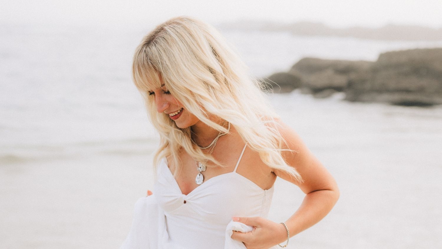 Lifestyle photoshoot of young woman on Laguna Beach Coastline with Sunset Photography by Makenzie Rae Photography