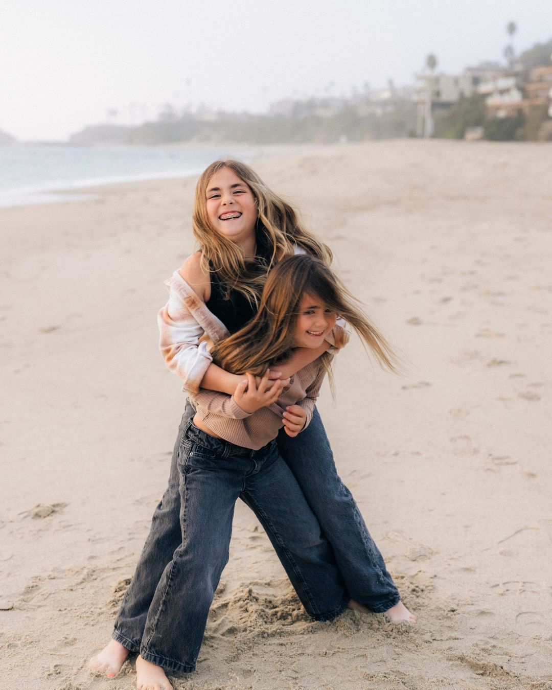 Children walking together at the beach, photography by Makenzie Rae Photography, Orange County California.