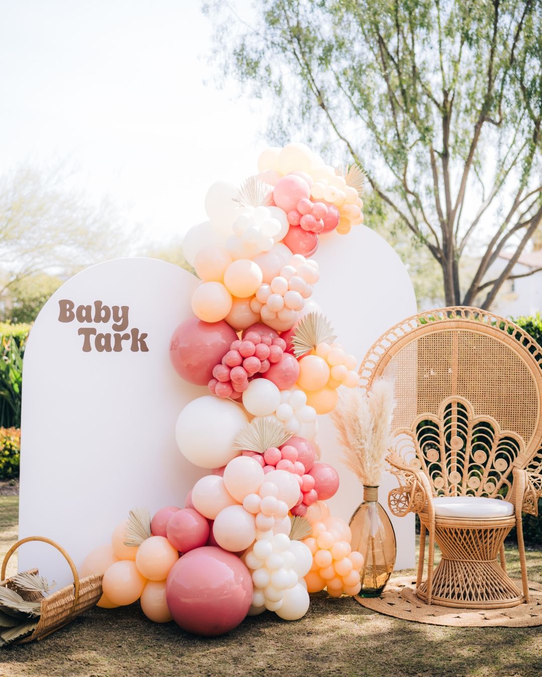 Pink and white balloon arch at an outdoor birthday celebration in Orange County, event photography by Makenzie Rae Photography, Orange Count
