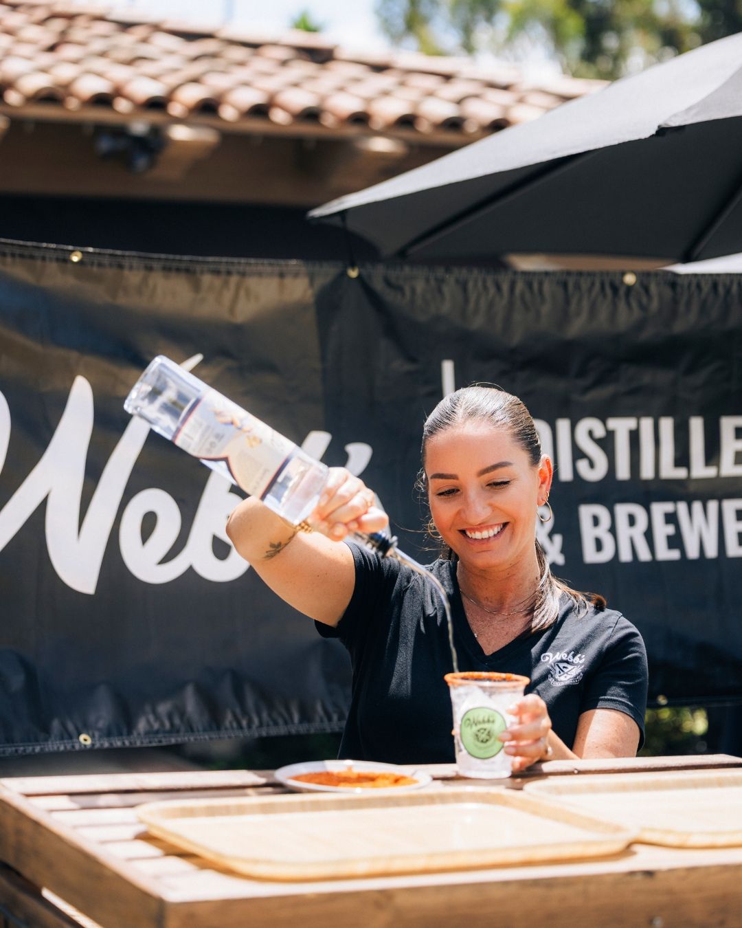 Guests at an outdoor distillery event in Southern California, event photography by Makenzie Rae Photography, Orange County California.
