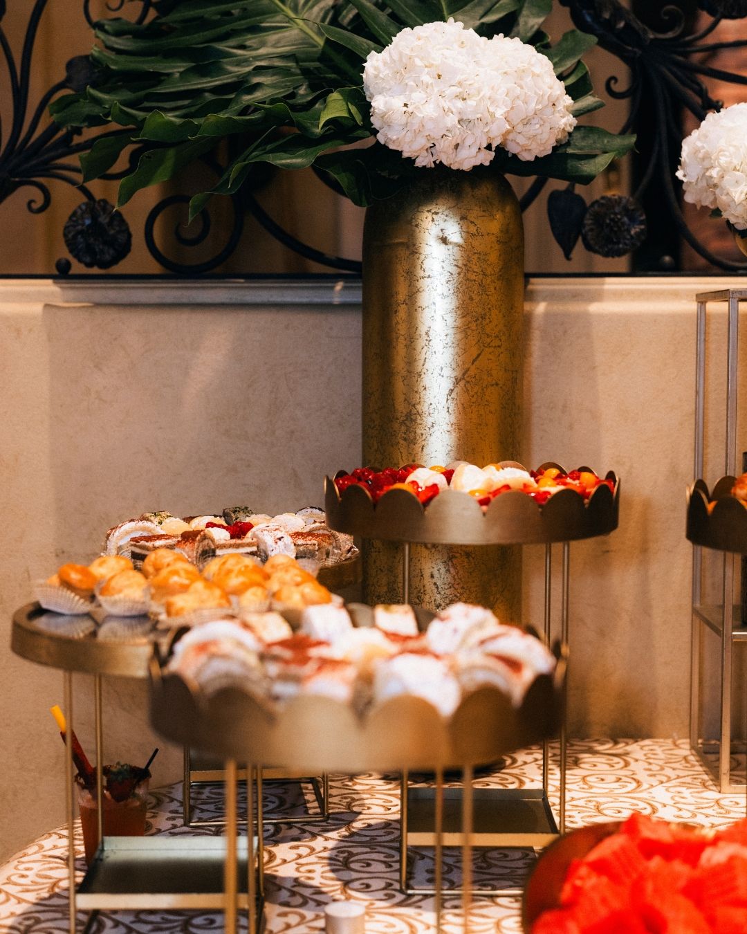 Elegant event decor with floral arrangements and candles, Orange County event photography by Makenzie Rae Photography.