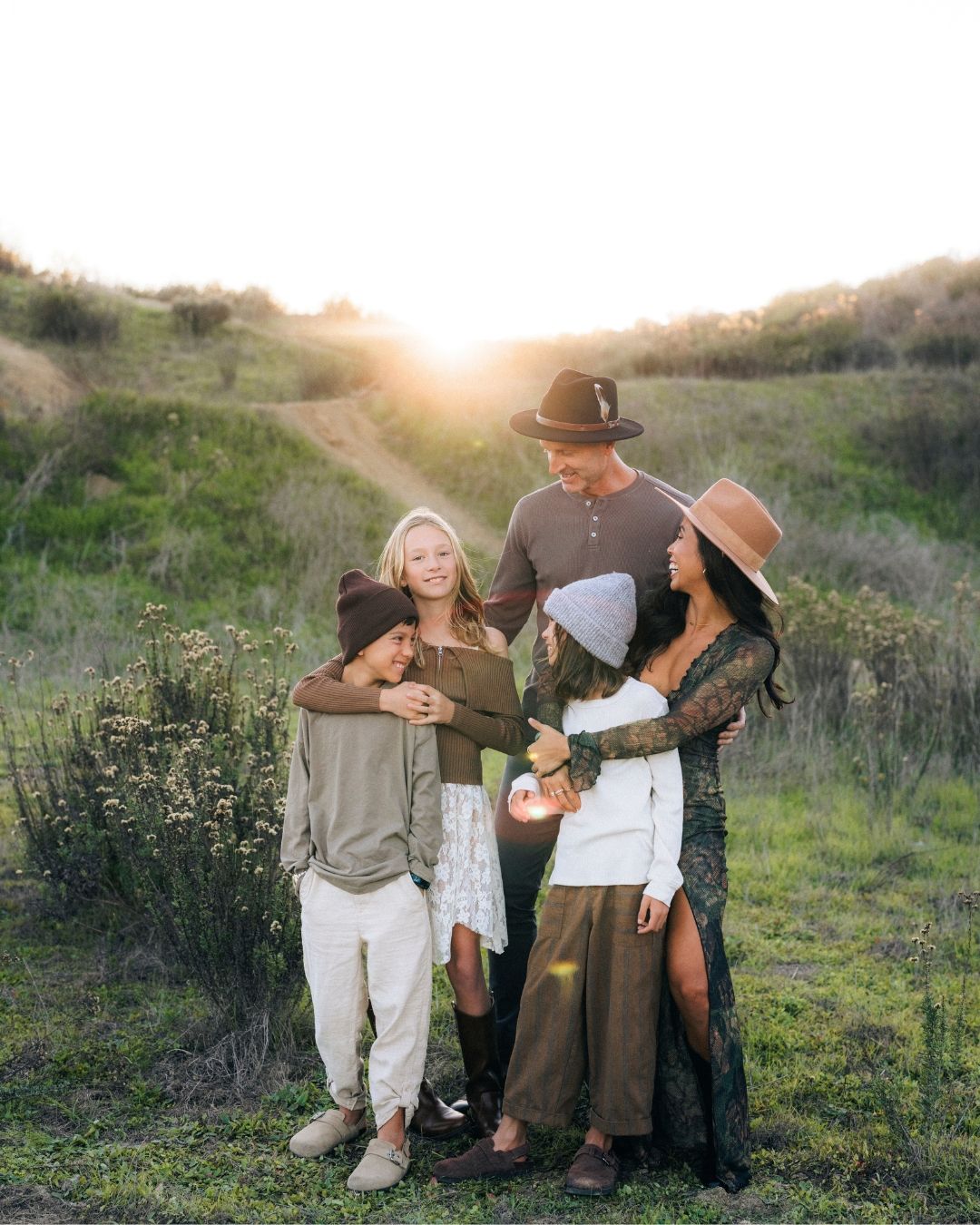 Family embracing in Laguna Beach canyon, photographed by Makenzie Rae Photography, Orange County California