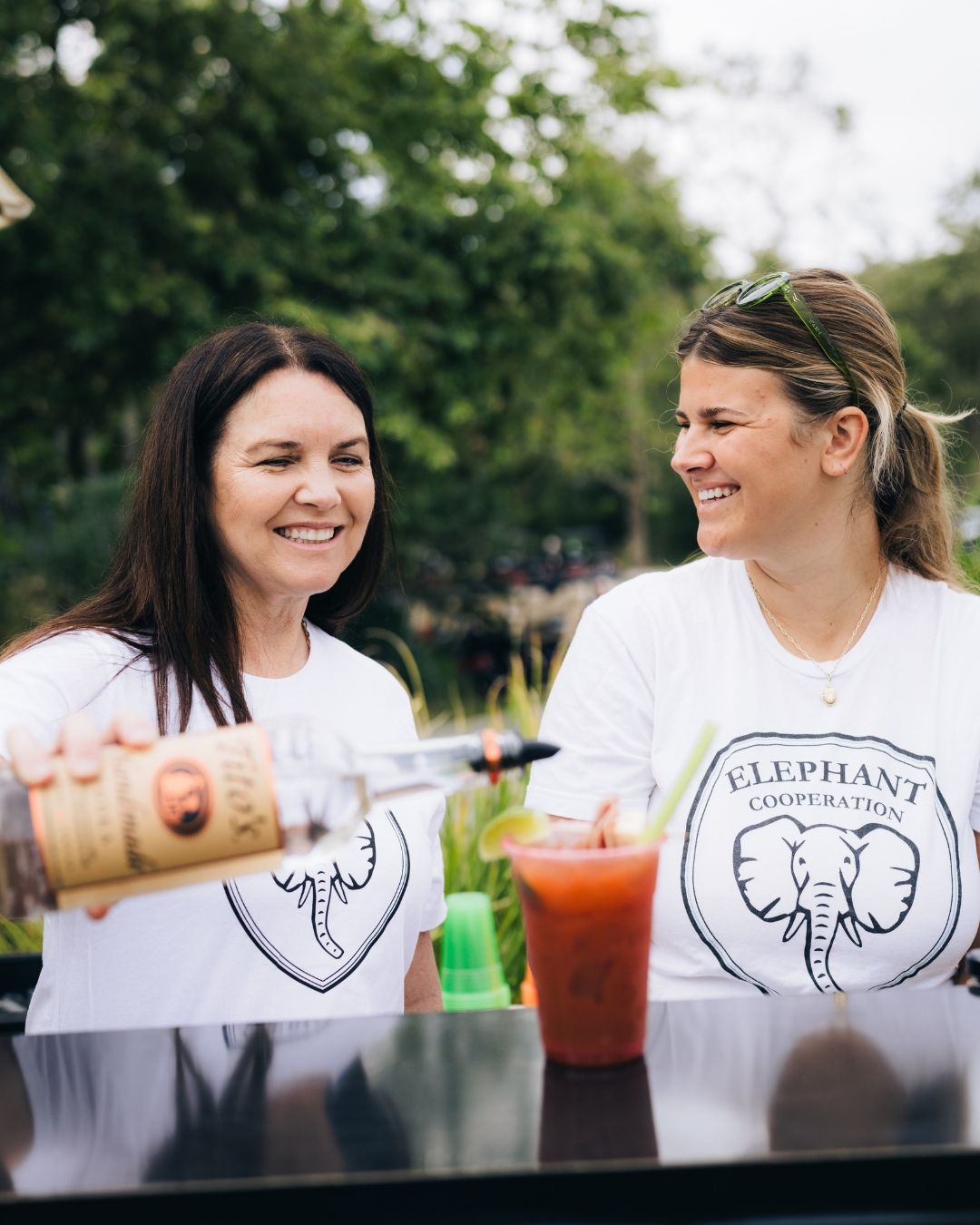 Two women smiling at a birthday celebration in Orange County, event photography by Makenzie Rae Photography, Orange County California photog