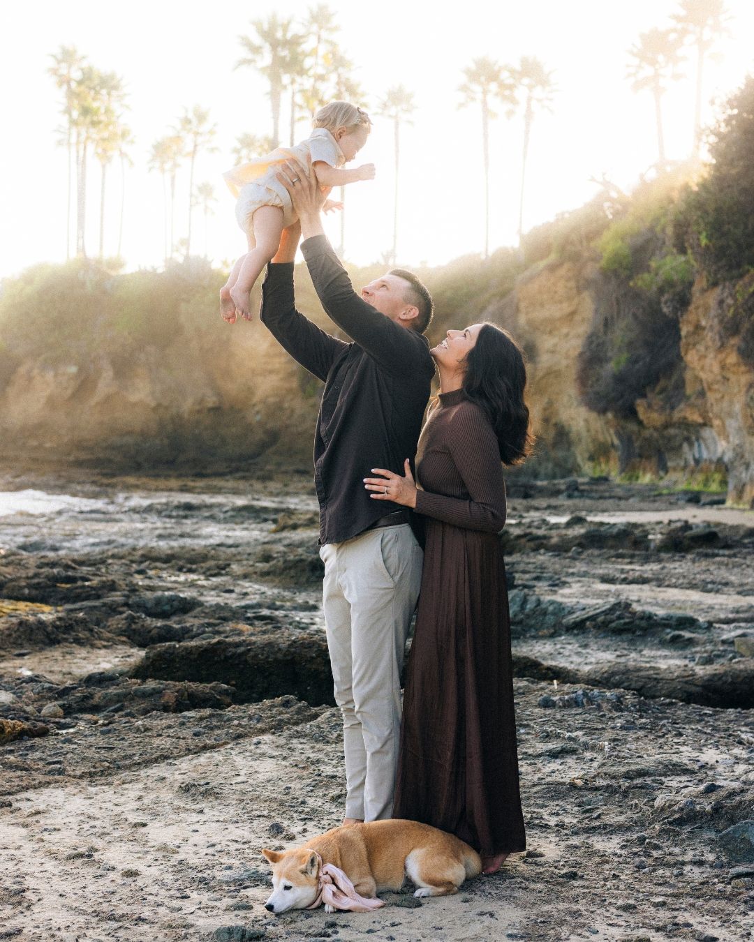 Family photo at the beach with newly born child for a outdoor portrait session with orange county photographer makenzie romano