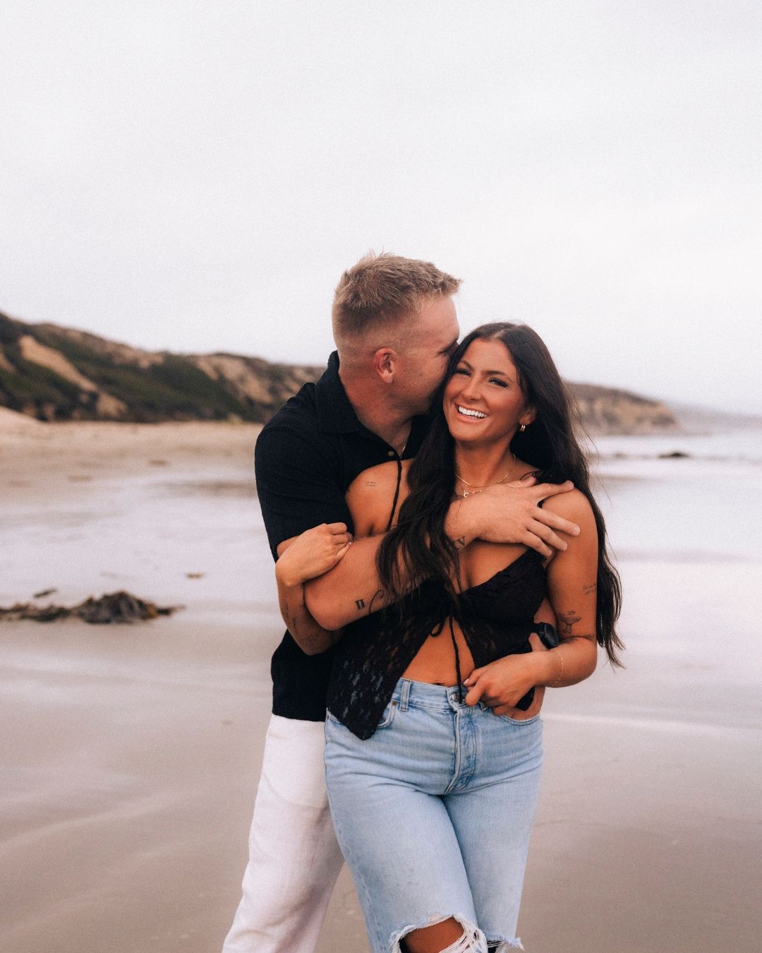 couples embracing for a photoshoot with Makenzie Rae Photography in Orange County California