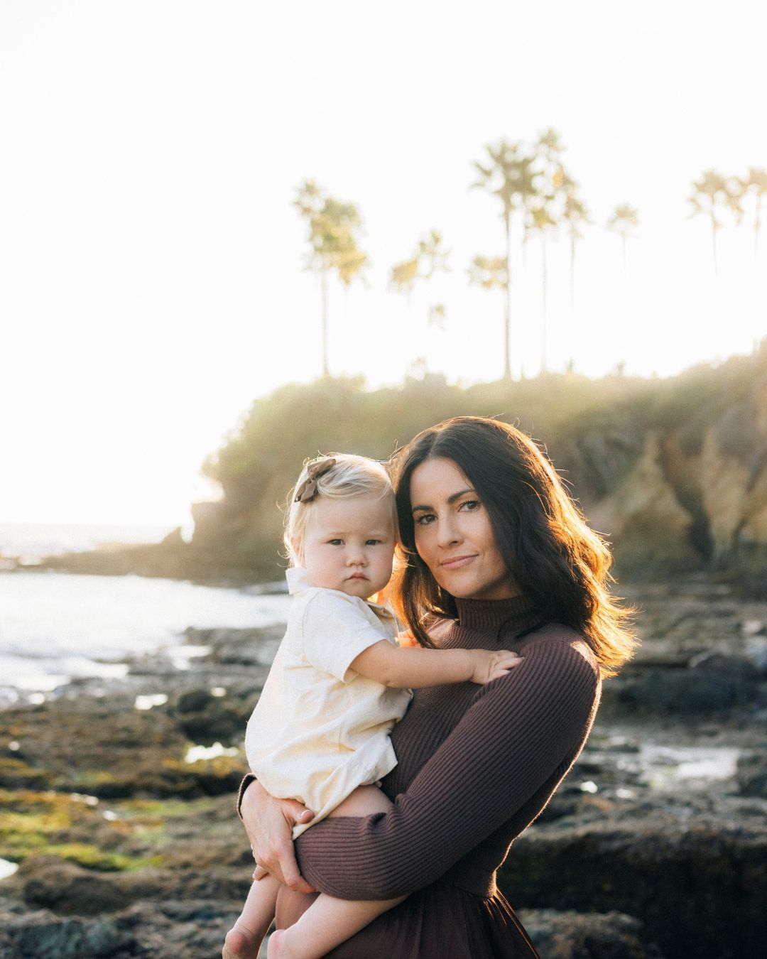 Mom embracing child during portrait session in Orange County, photographed by Makenzie Rae Photography, Orange County California pho