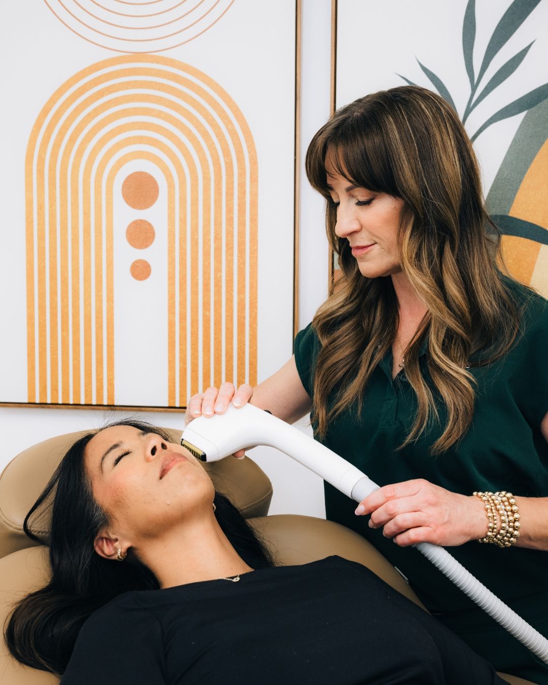 Two women in an elegant styled portrait session with arch decor, photographed by Makenzie Rae Photography, Orange County California portrait