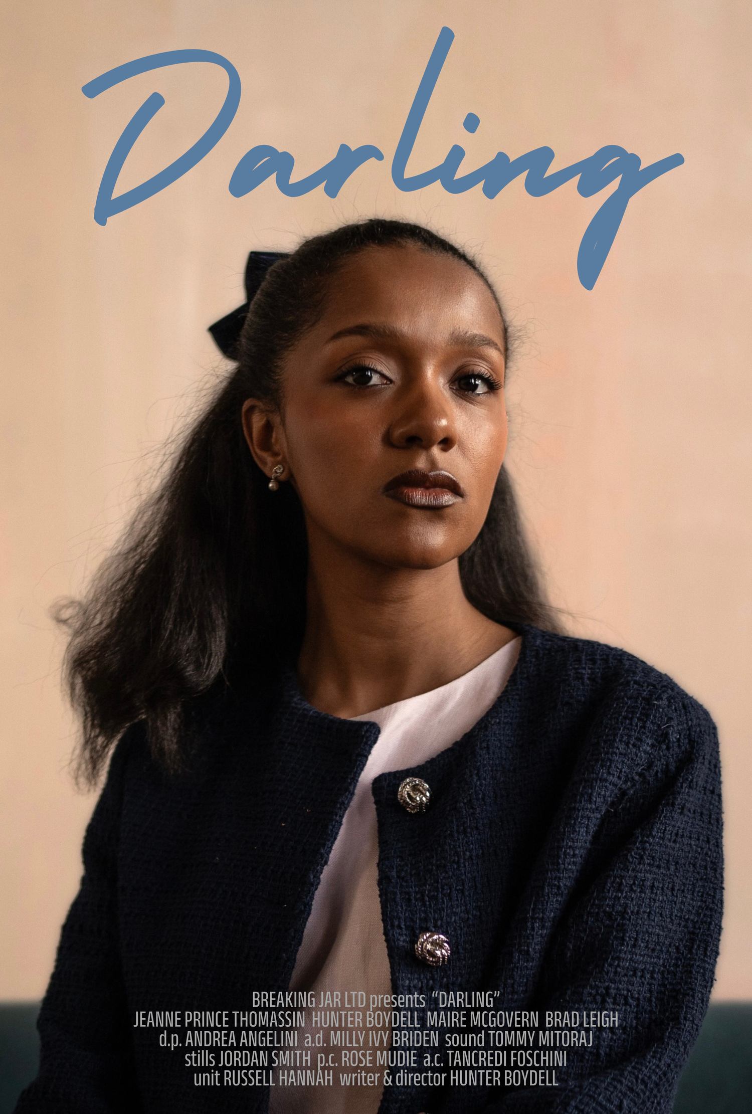 Movie poster for Darling featuring a young Black woman in a navy blazer with a bow in her hair against a beige background.