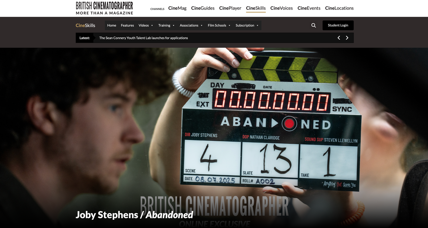 British Cinematographer website featuring Joby Stephens on the set of the film Abandoned with a clapperboard.