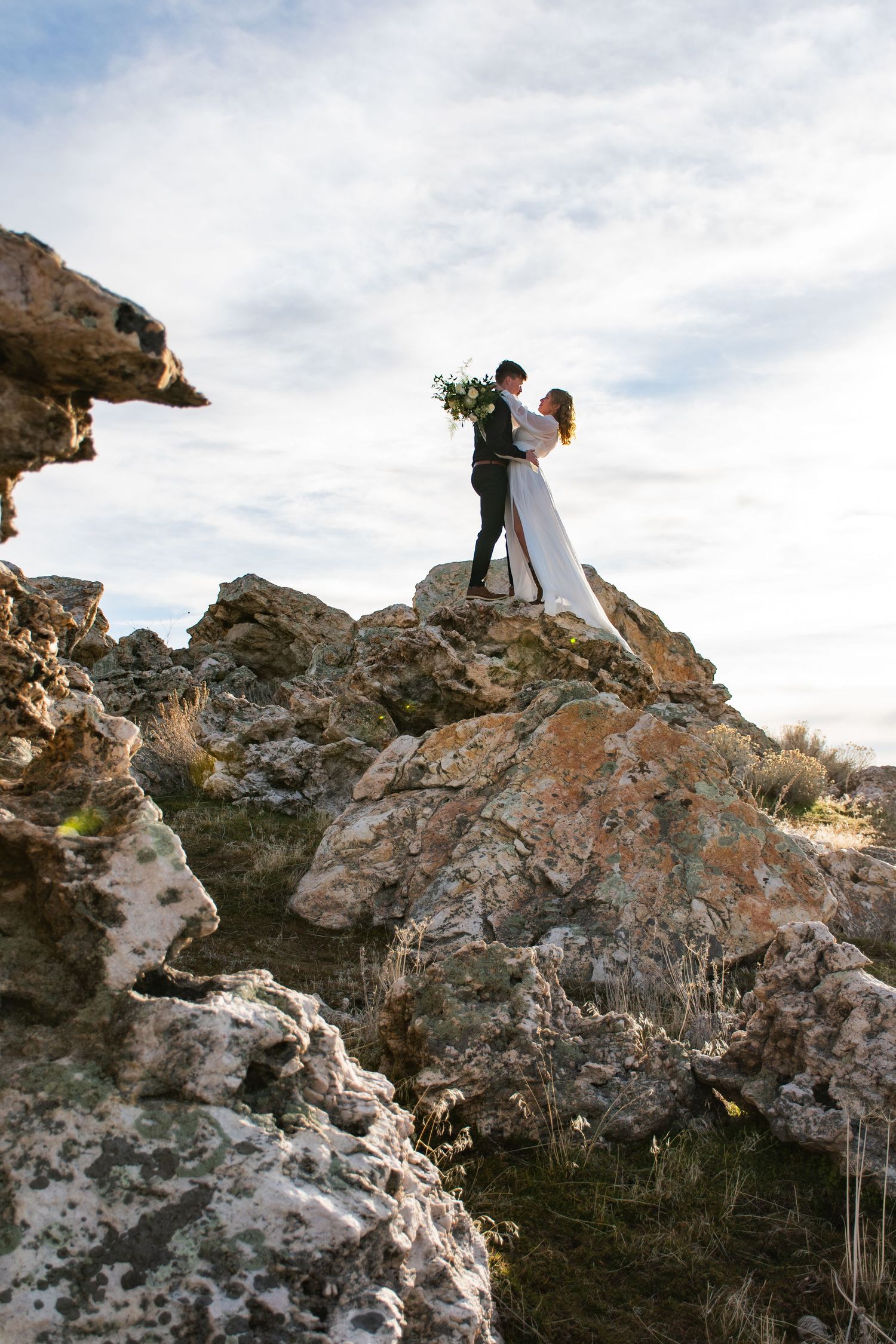 Bride and groom in a cinematic photo on Antelope island in Utah.