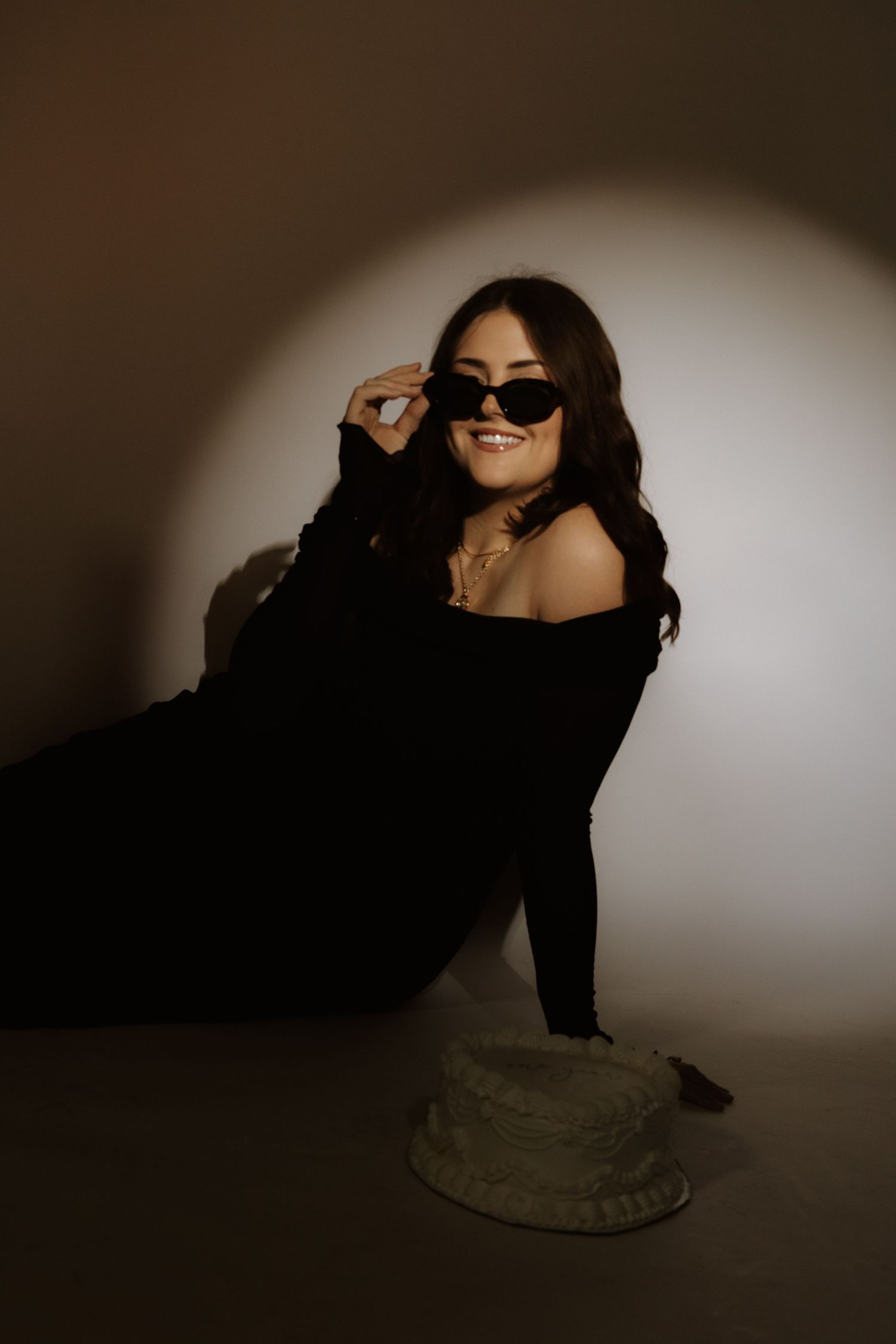 Dramatic black and white photo series showing a person in dark clothing moving fluidly against a light background.