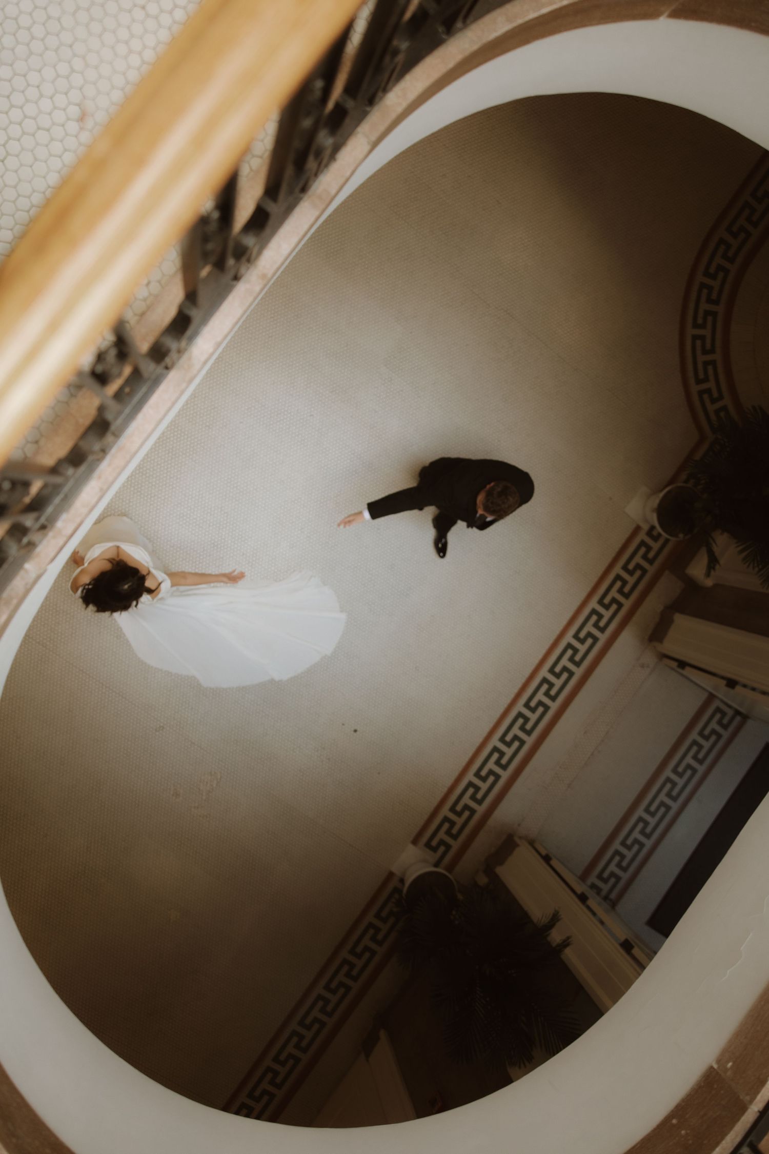 A series of dark, moody photographs showing a curved ceiling corner with decorative Greek key pattern border molding.