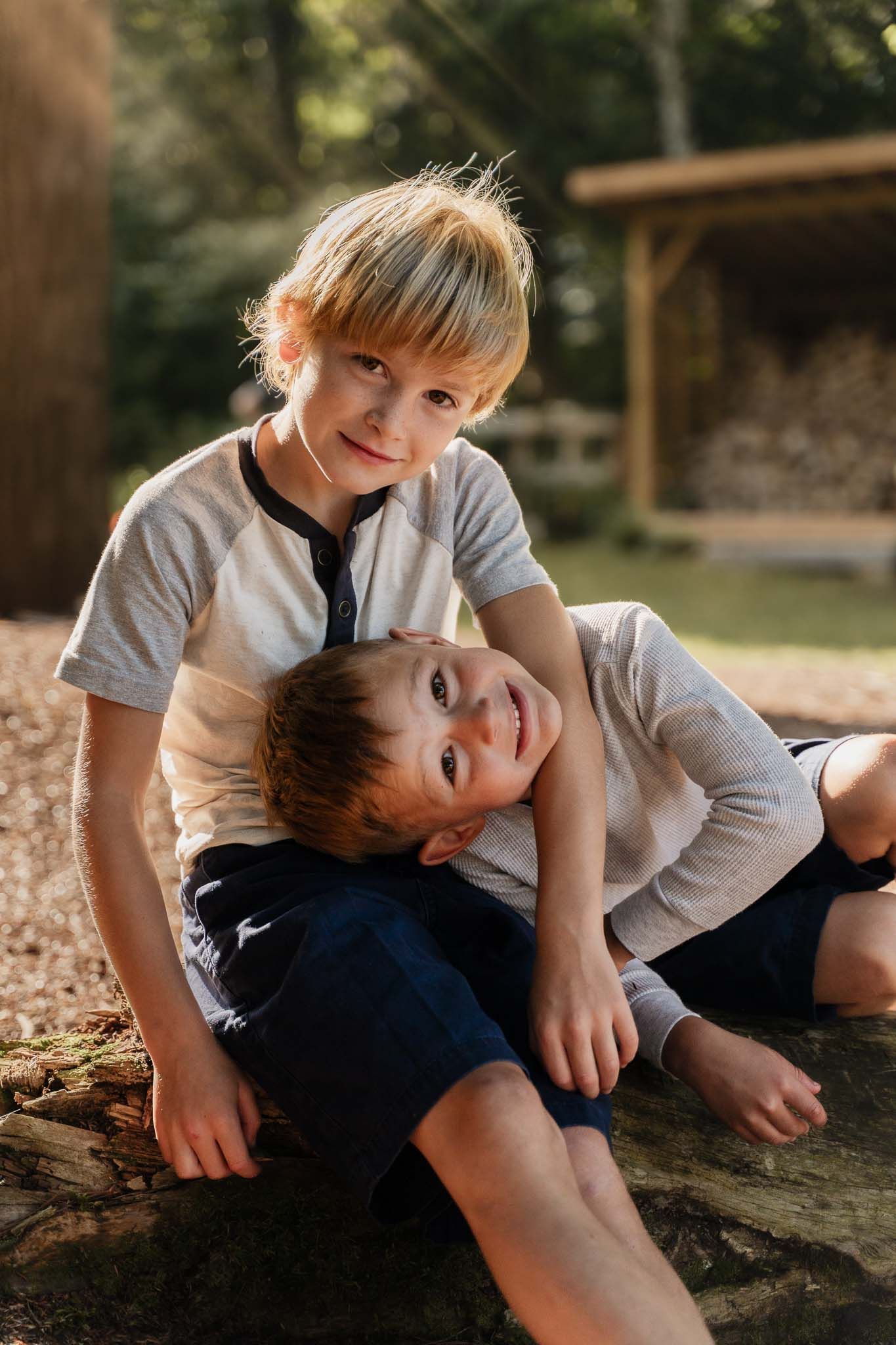 Two young siblings spending quality time together outdoors on a sunny day.