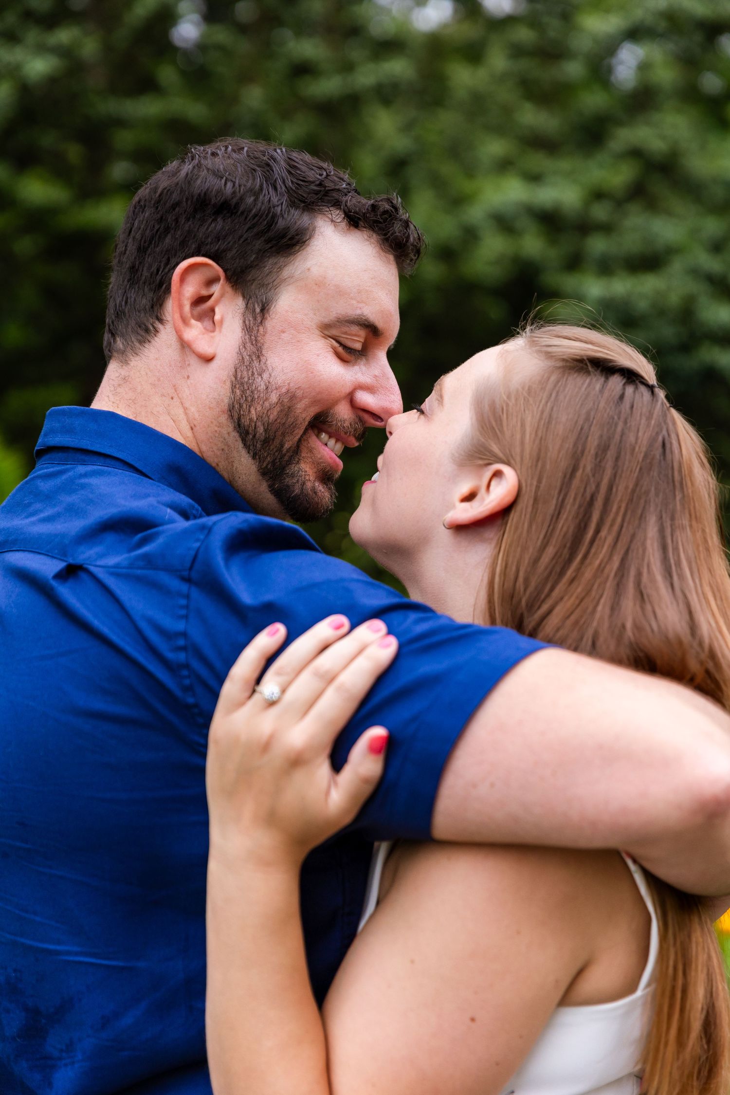 Romantic couple sharing an intimate moment outdoors.