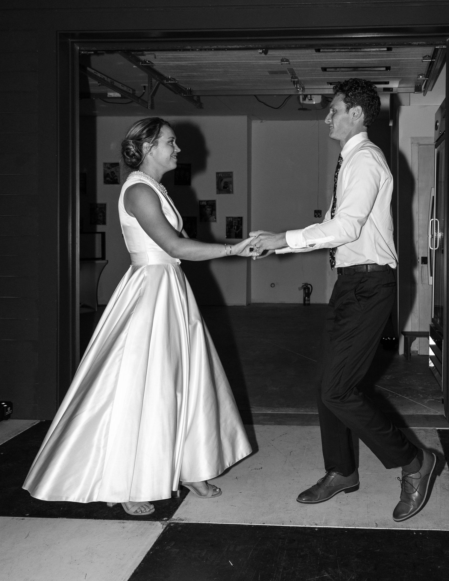 A sequence of black and white photographs showing two people dancing together in an indoor setting.