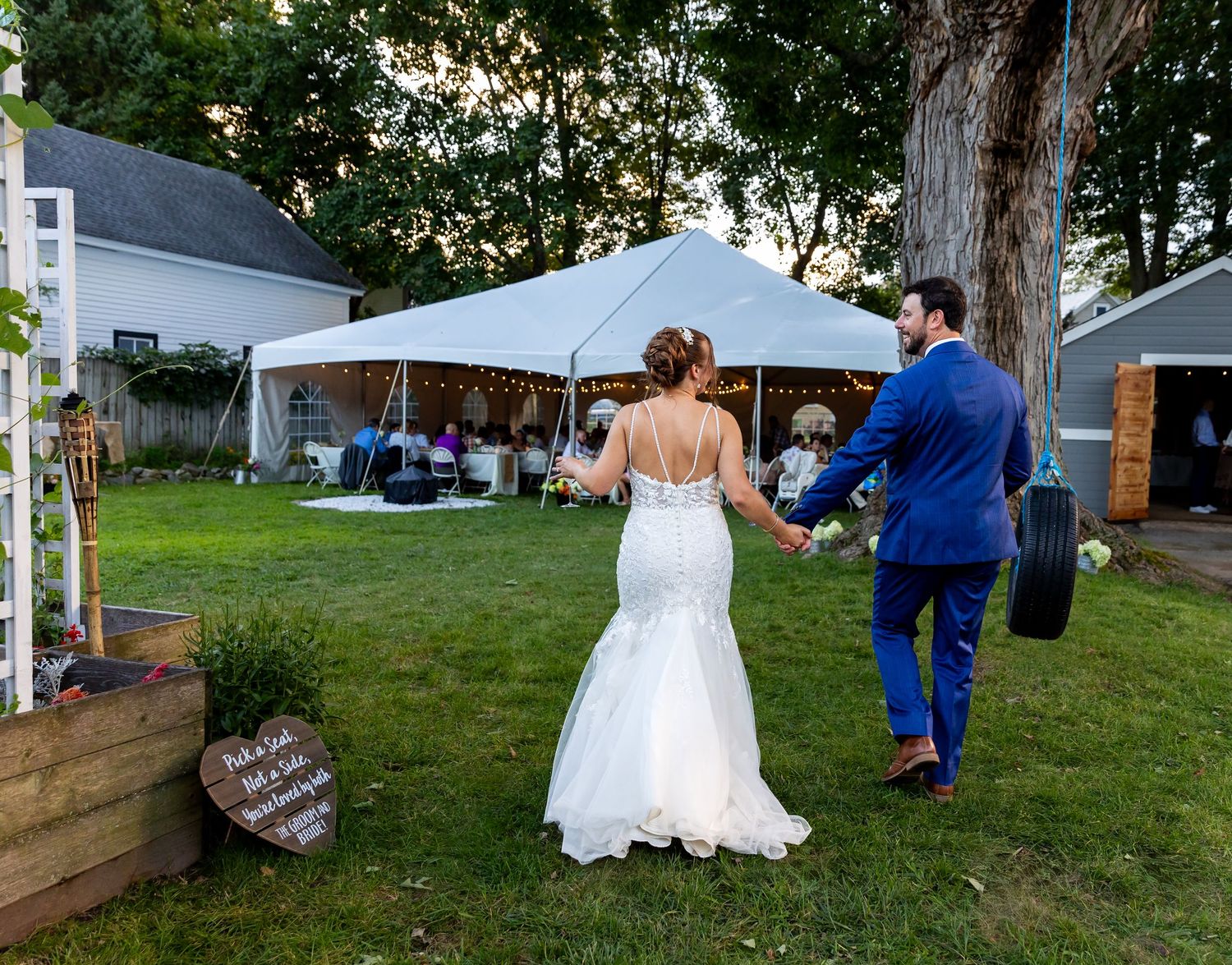 A candid sequence of five photos shows a person in a white dress moving through an outdoor wedding reception setting.