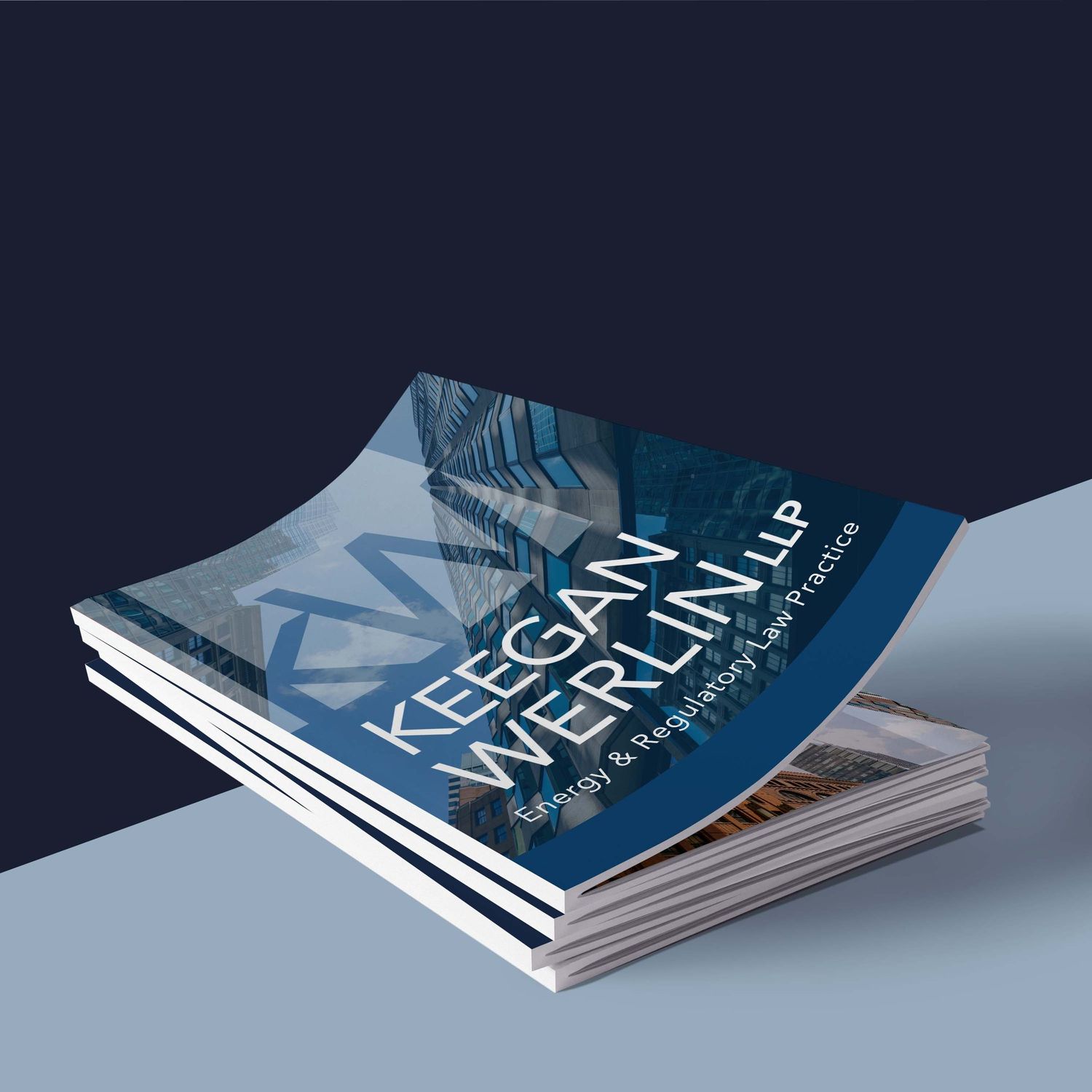 Stack of white minimalist magazines or brochures laid out at various angles displaying clean modern design layouts.