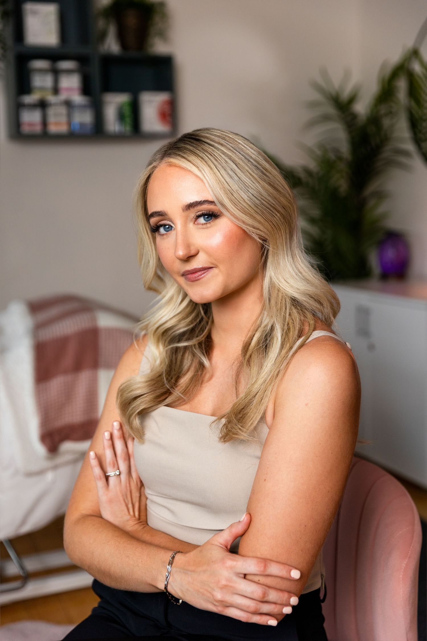 Portrait photo sequence showing a woman with blonde hair posing on a pink chair in a light-filled room with plants.