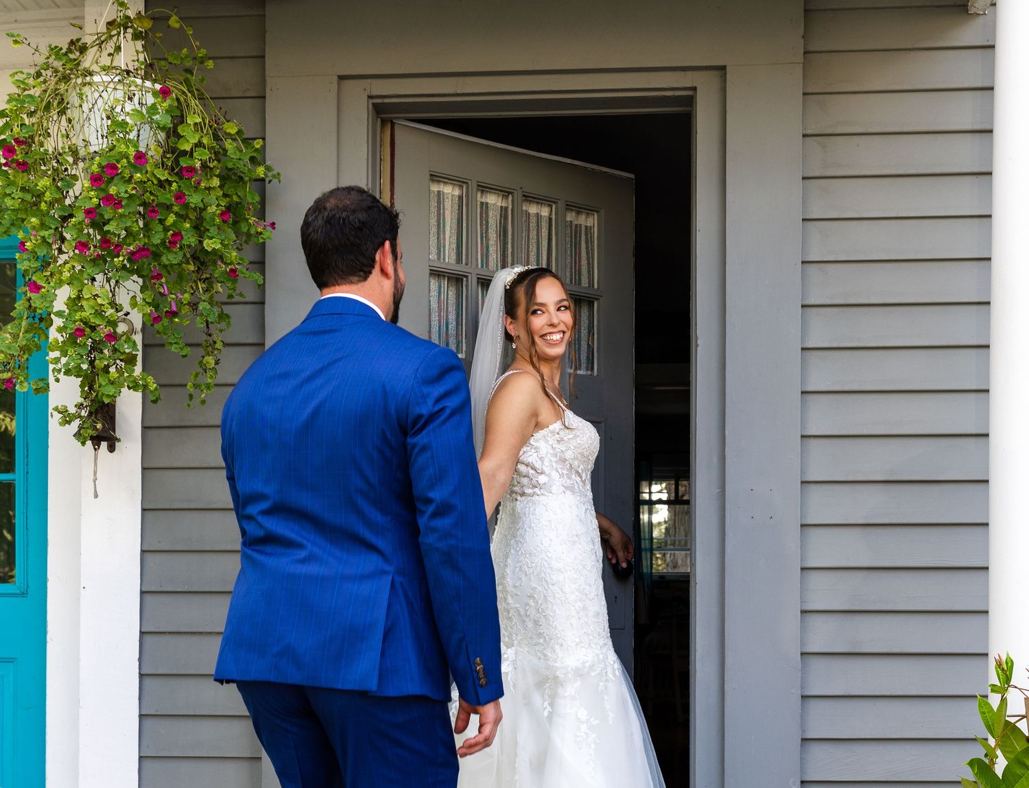 Dual views of a couple in white wedding dress and blue suit entering a doorway at a house with white siding.