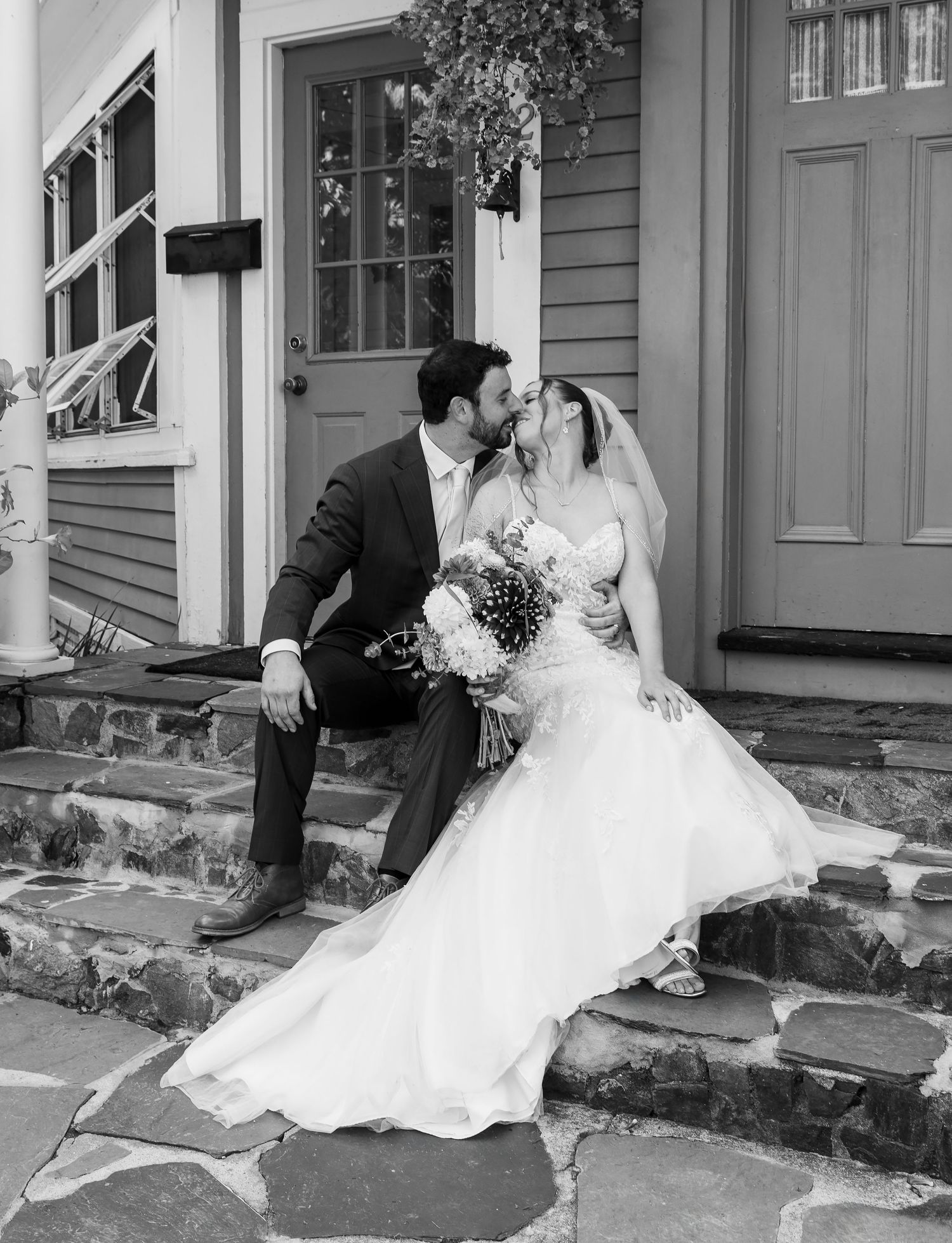 A romantic wedding photo sequence shows a couple embracing and dipping in a romantic kiss on outdoor stone steps.