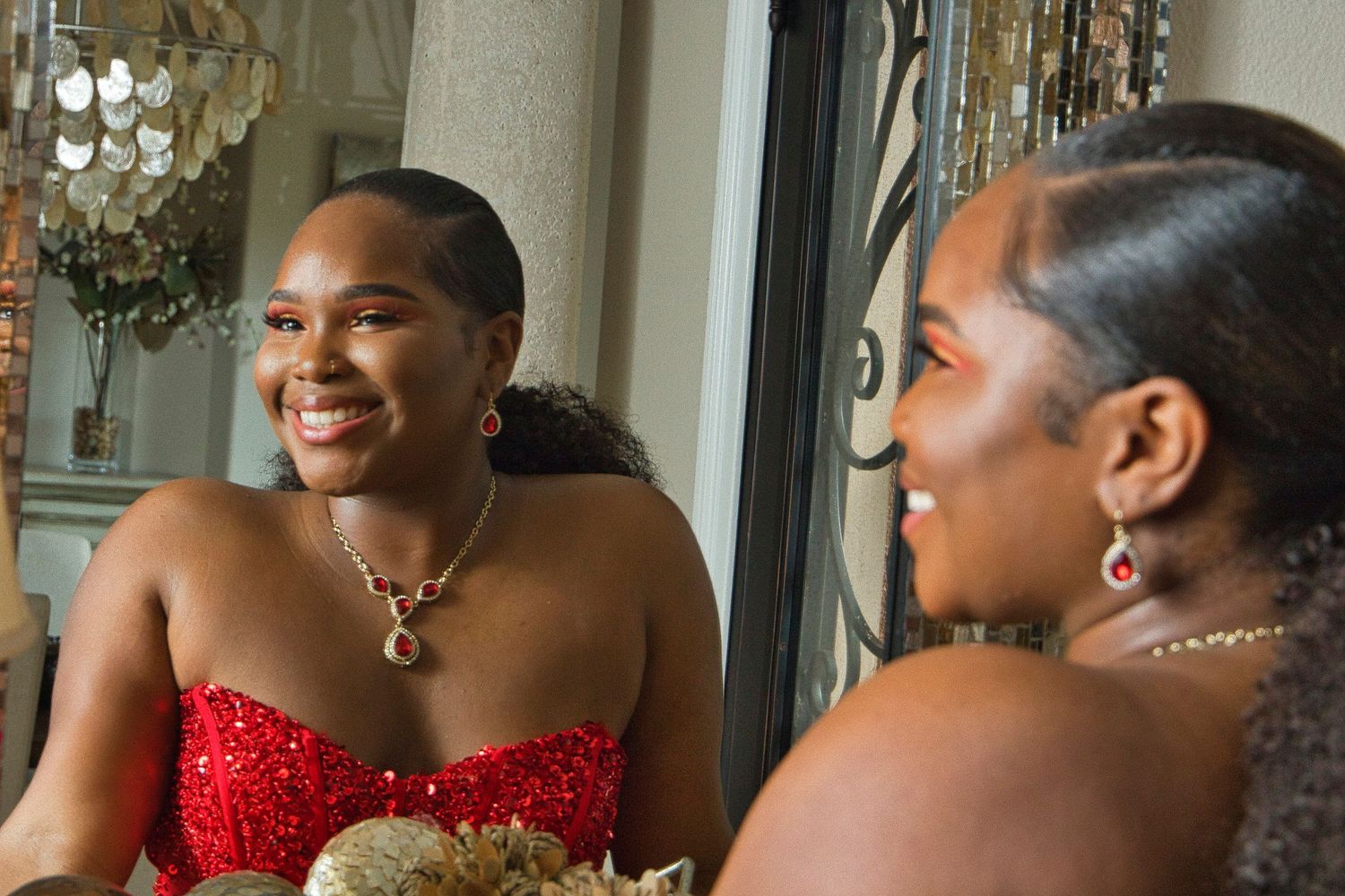 Beautiful formal occasion captured in an elegant indoor setting with chandelier.