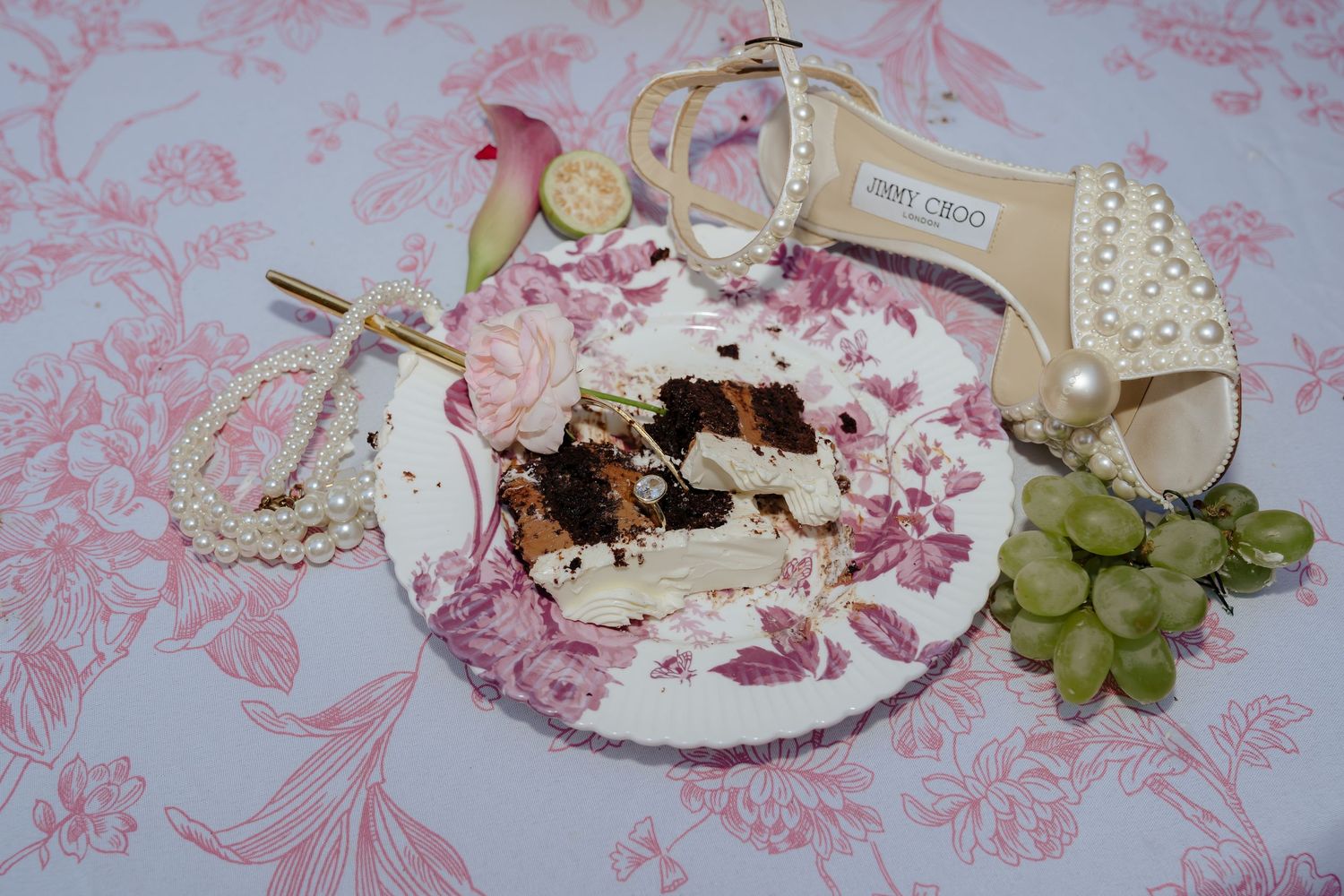A collage of pink and white table settings with floral patterns, grapes, and dessert plates arranged in a romantic style.