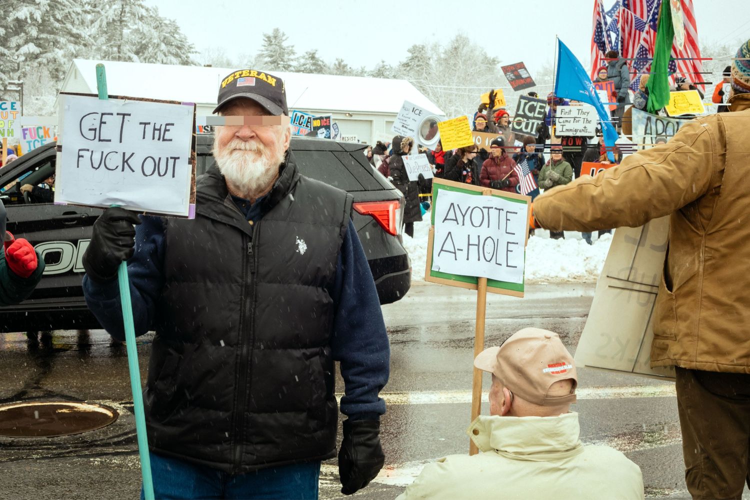 One veteran holding a sign that reads, 