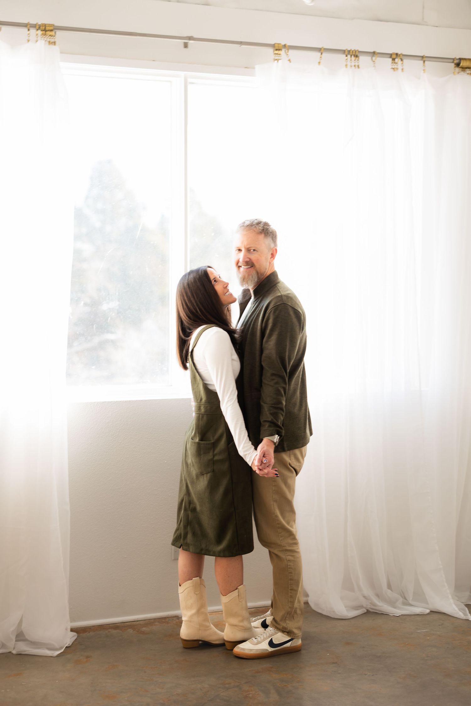 Romantic lifestyle photos in a bright studio space with white curtains and natural lighting.
