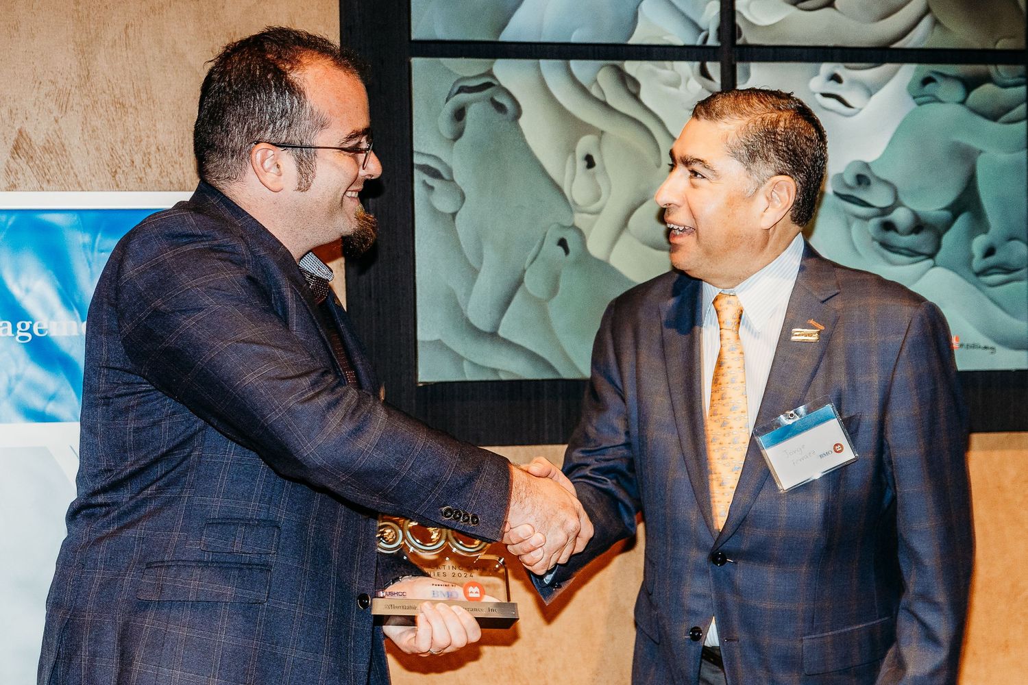 Series of professional handshakes and business interactions in formal setting.