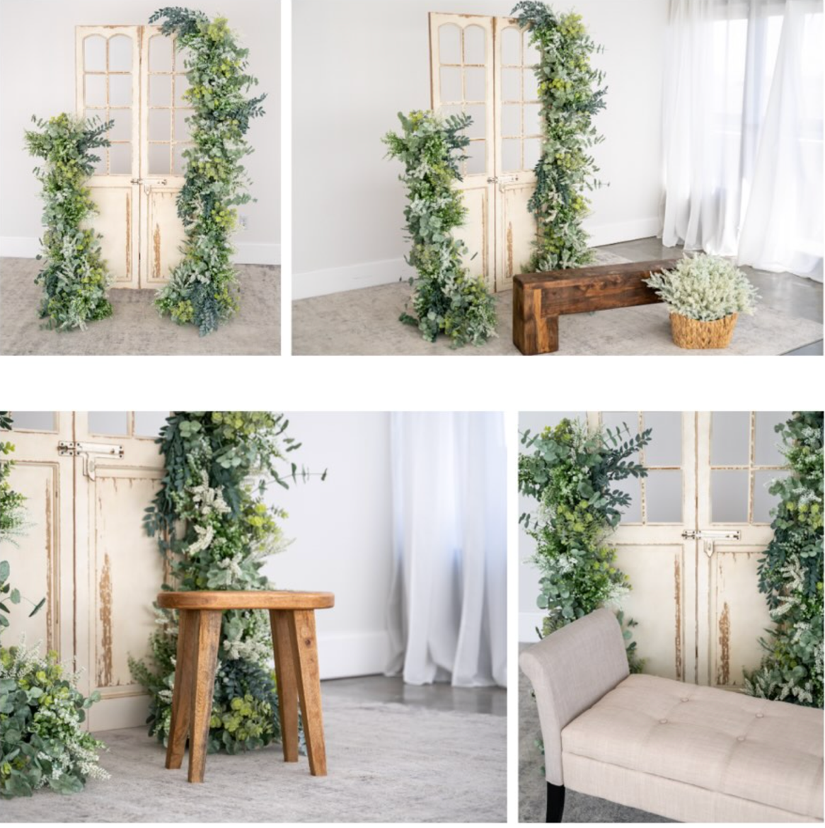 Elegant wedding backdrop with lush greenery garland on wooden arch, small round table, vintage doors, and beige sofa in bright studio.