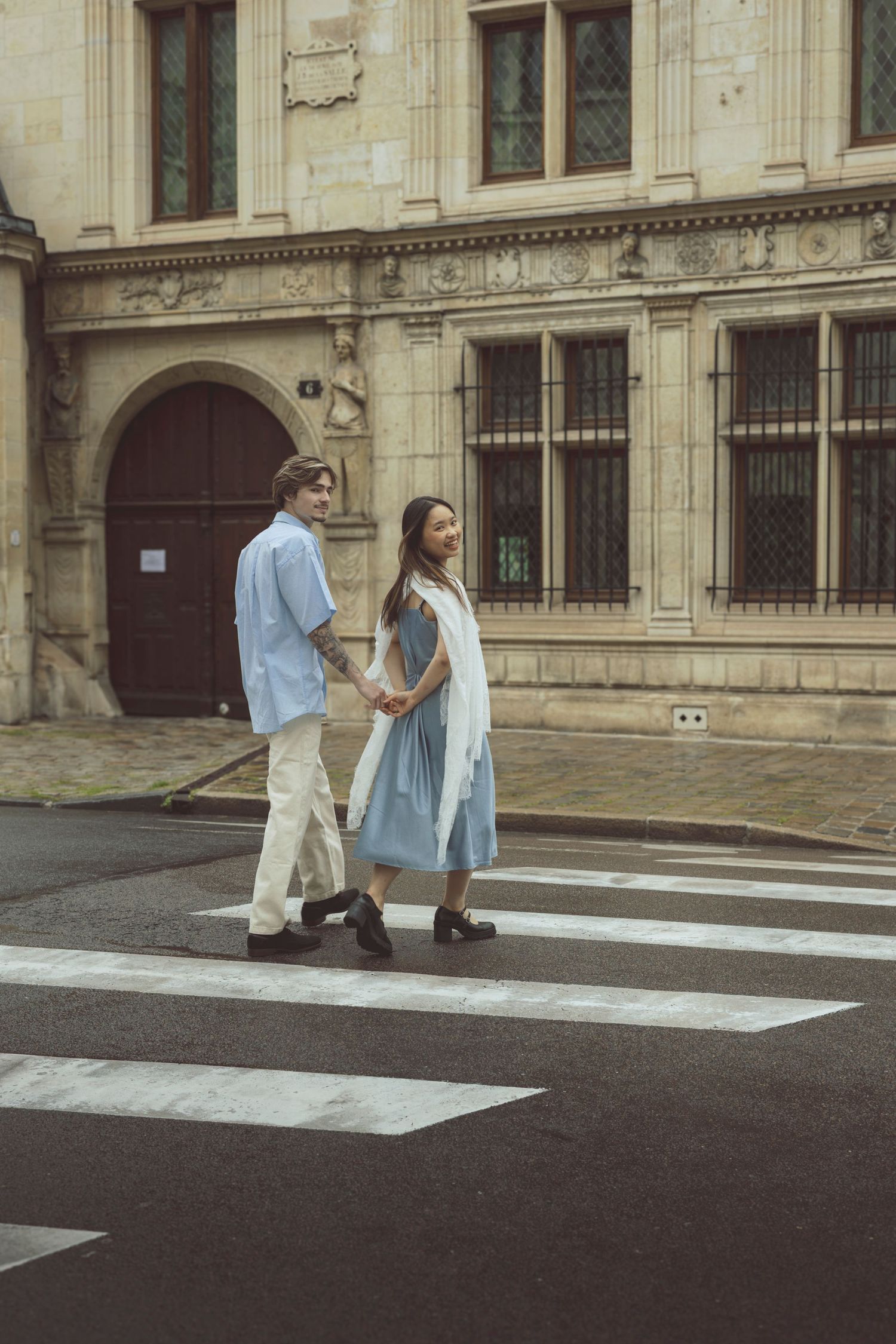 Couple holding hands during documentary-style photoshoot in the Netherlands