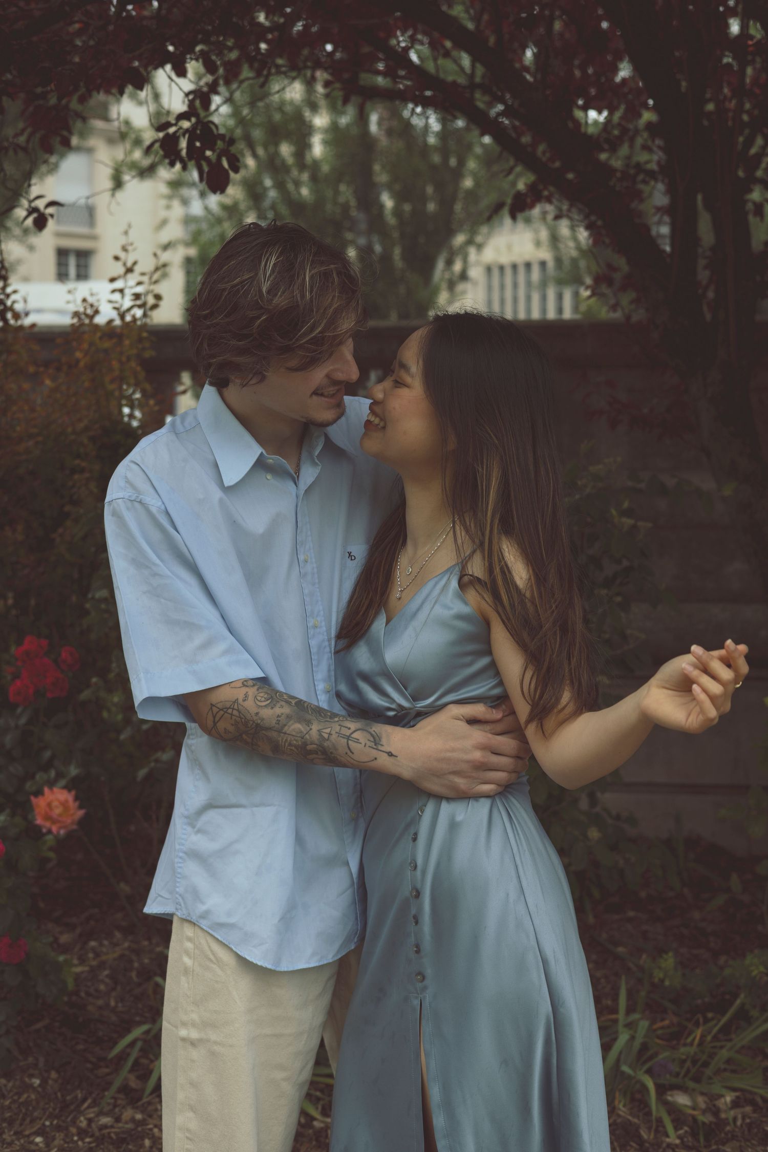 Candid couple laughter during relaxed outdoor photography session