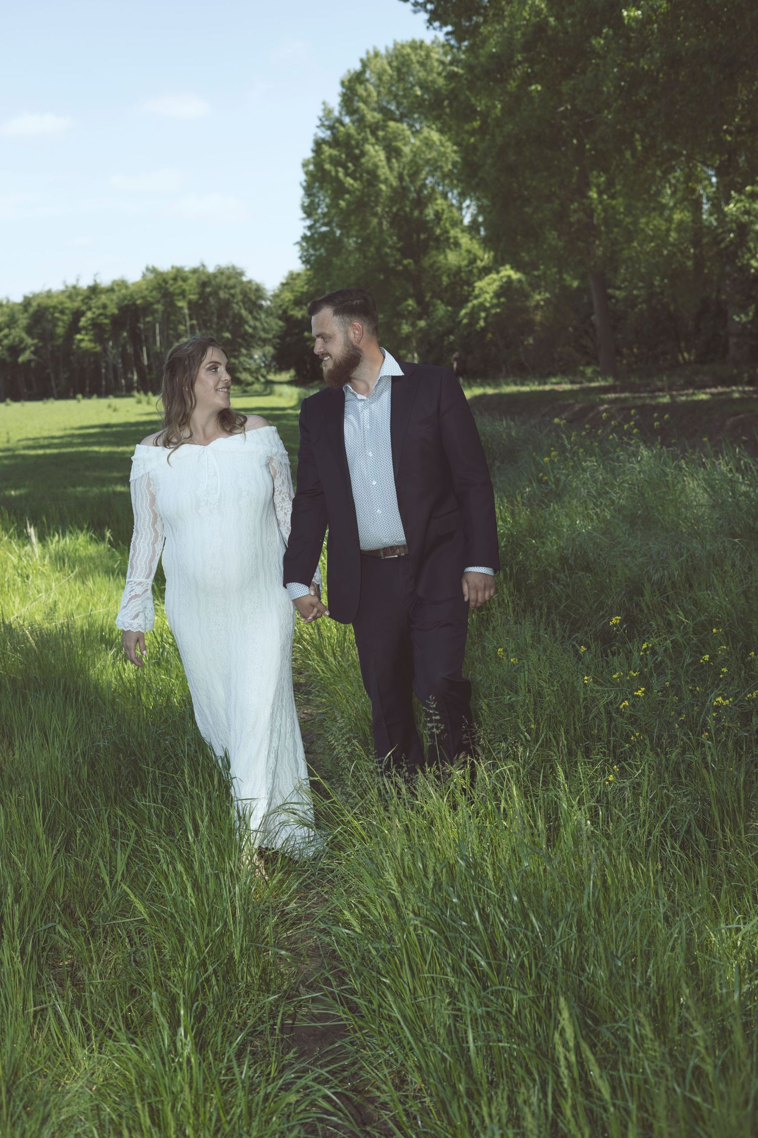 Bride and groom walking together during an intimate wedding ceremony in the Netherlands