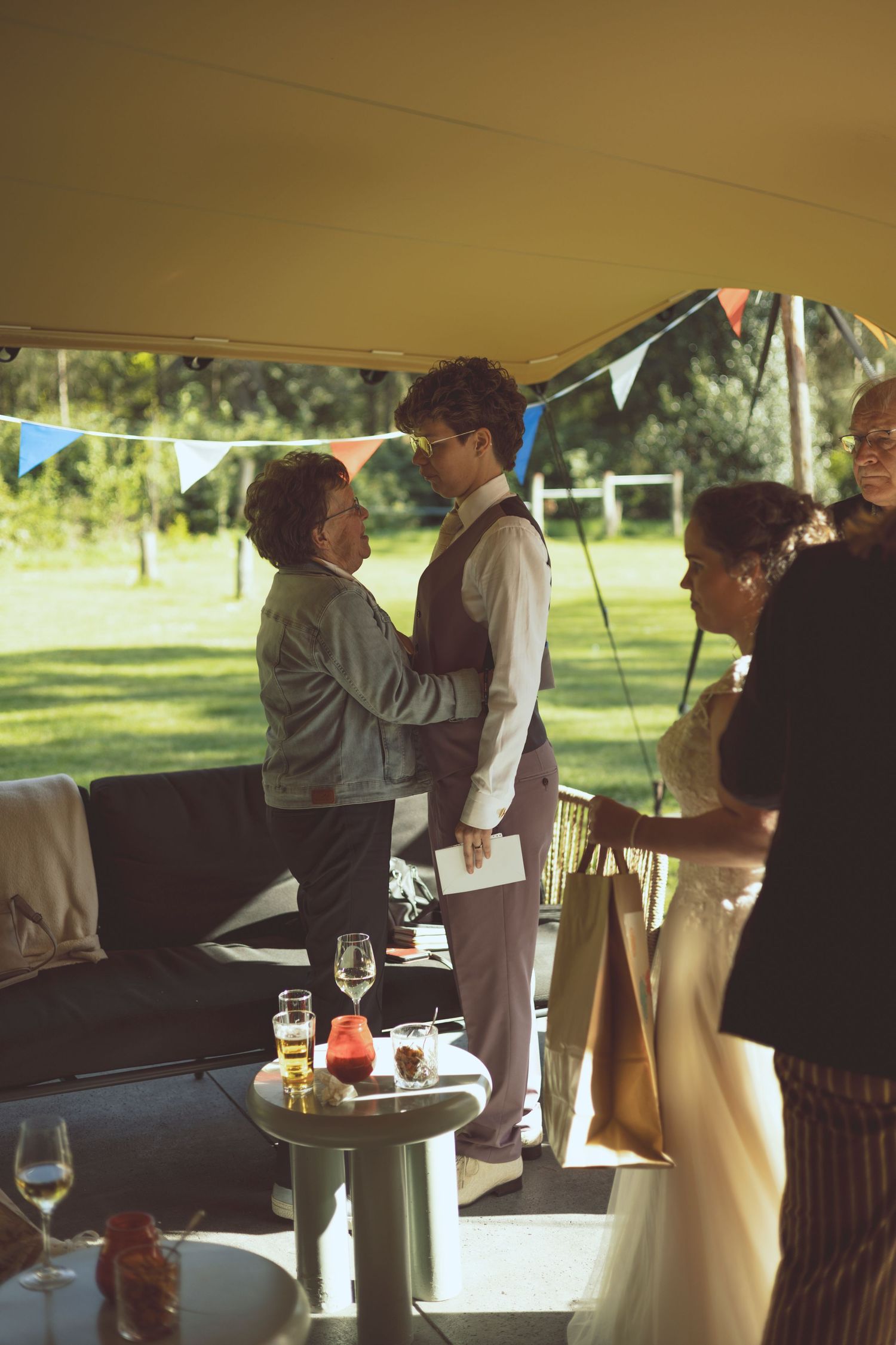 A candid moment of guests reacting during a heartfelt wedding speech