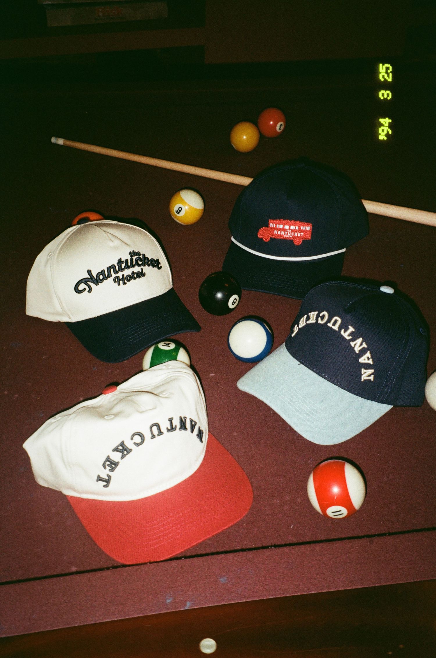 collection of hats on a pool table on film