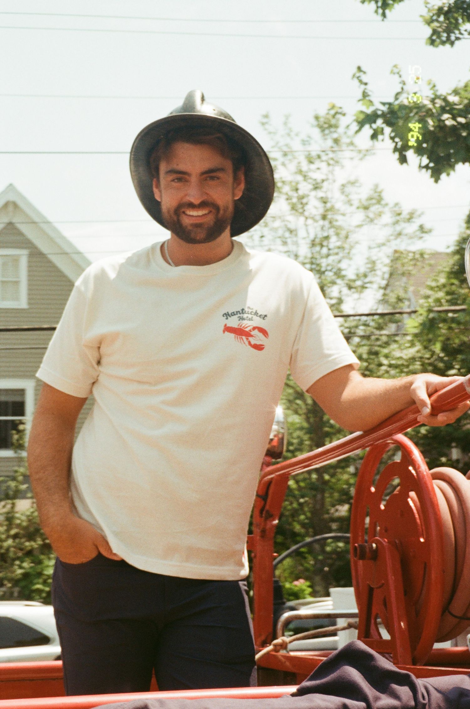 Man posing for photo in nantucket merchandise on film