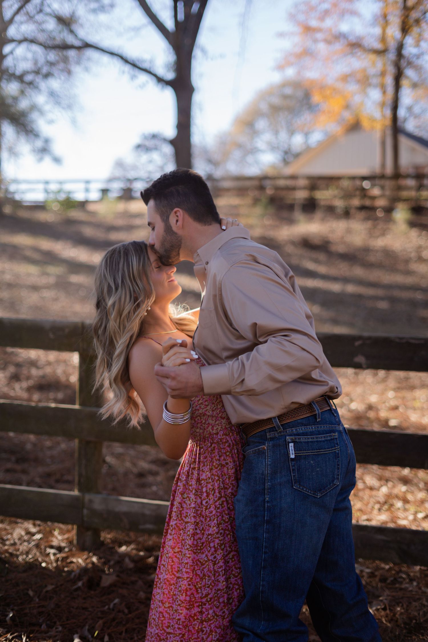 A romantic sequence of photos showing a couple in a rustic autumn setting with a wooden fence.