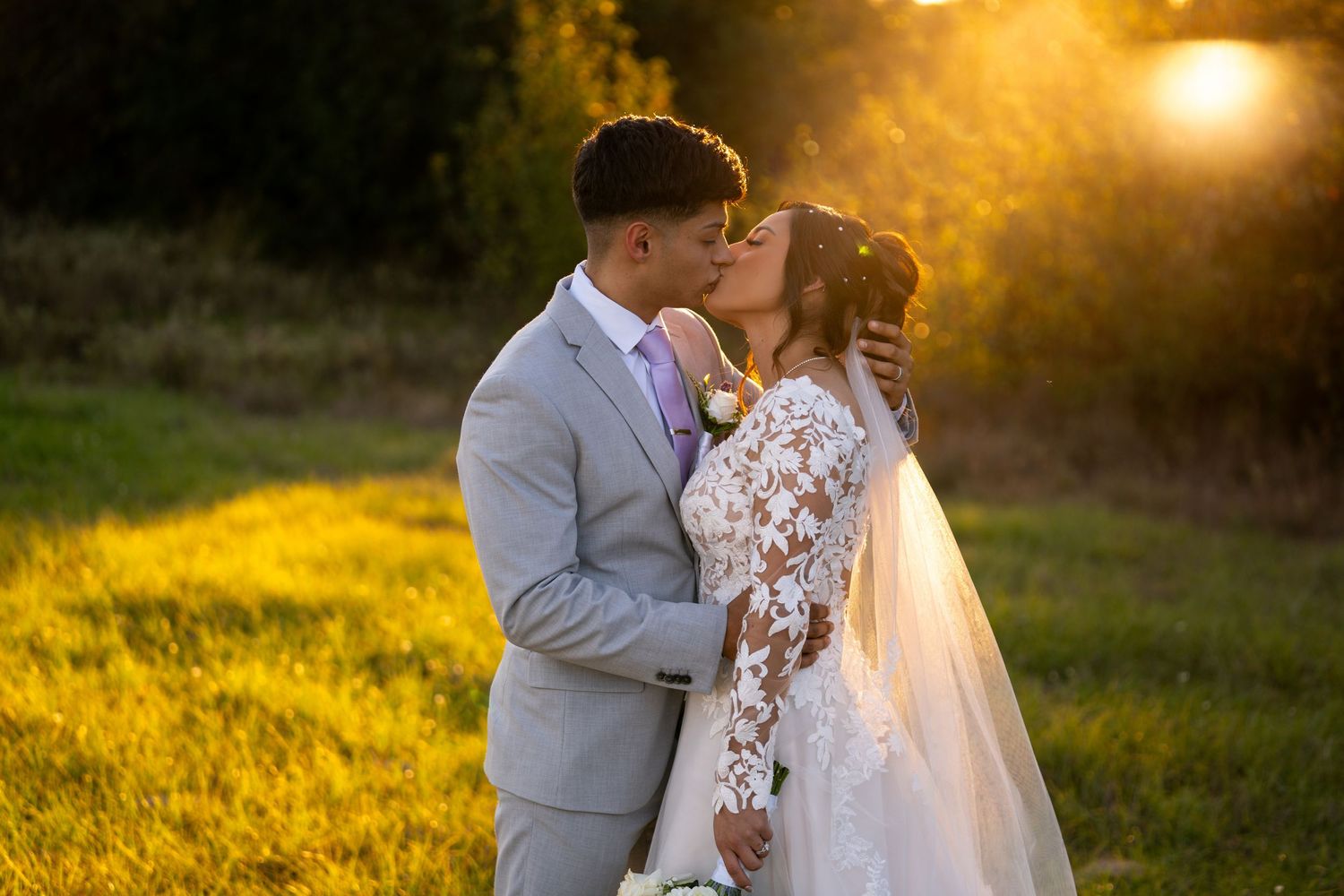 Romantic sunset wedding photos captured in golden hour light.