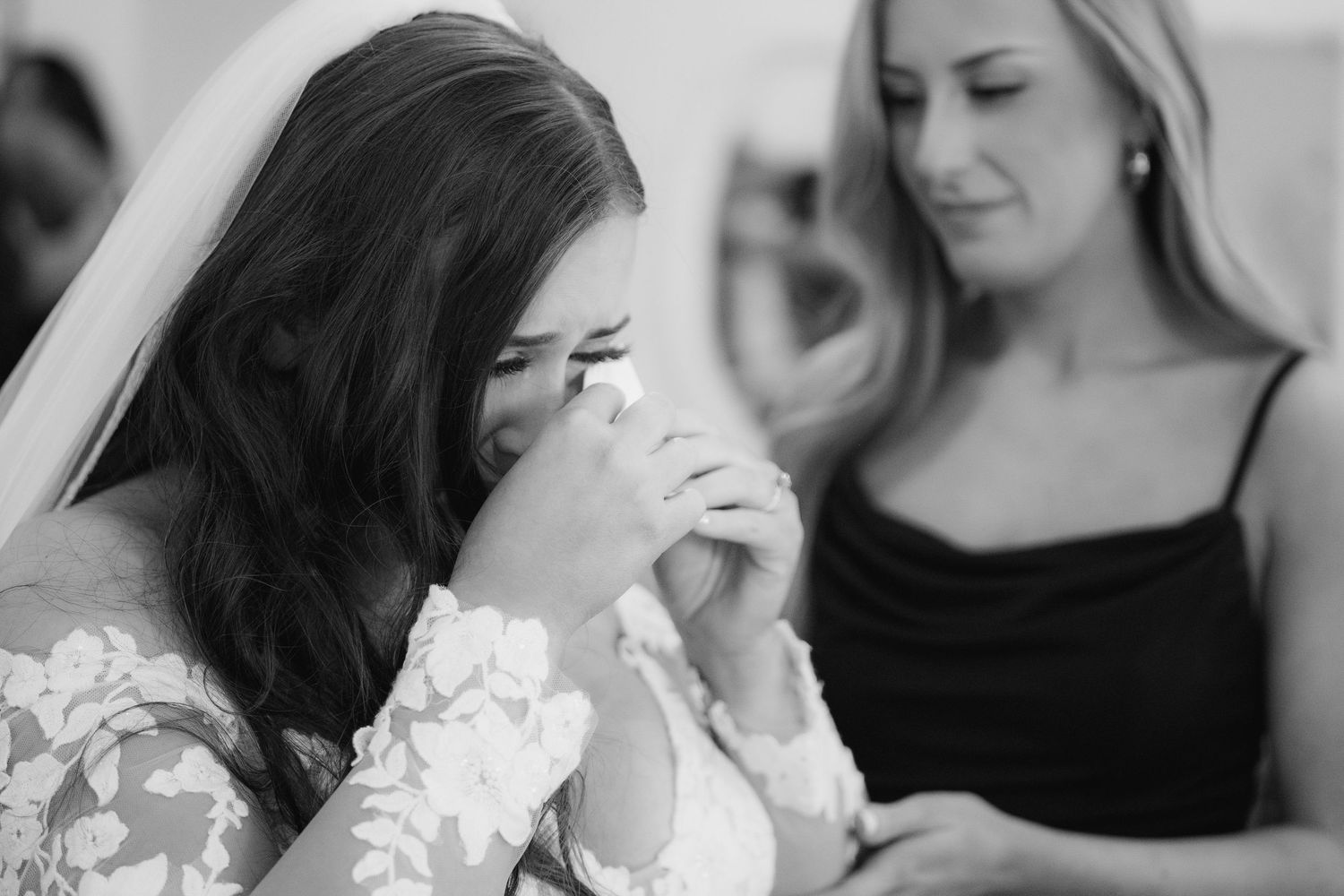 Black and white wedding photo collage showing intimate moments between couples and wedding party members.
