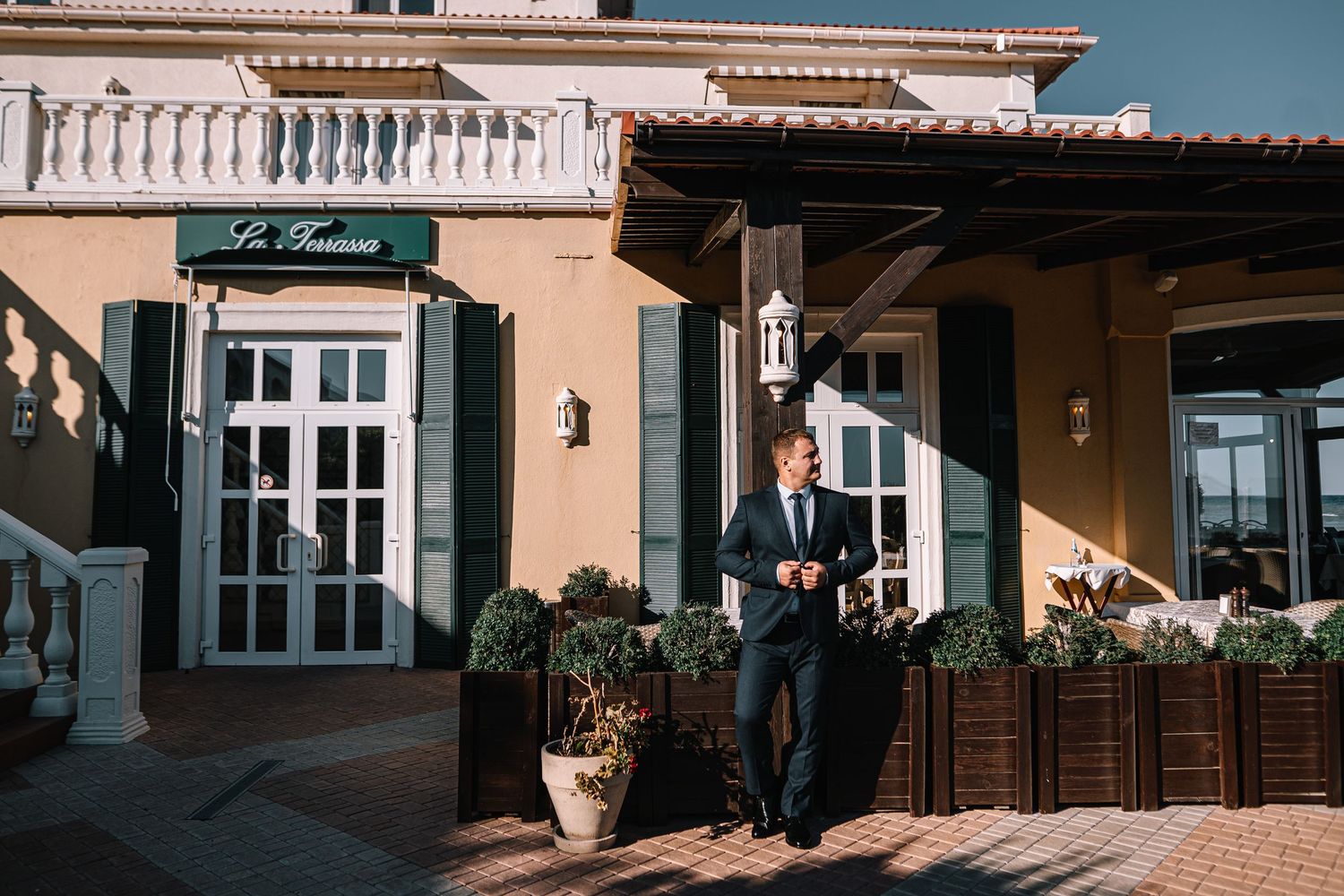 A series of connected images showing a Mediterranean-style house exterior with terracotta roof tiles and cream-colored walls.
