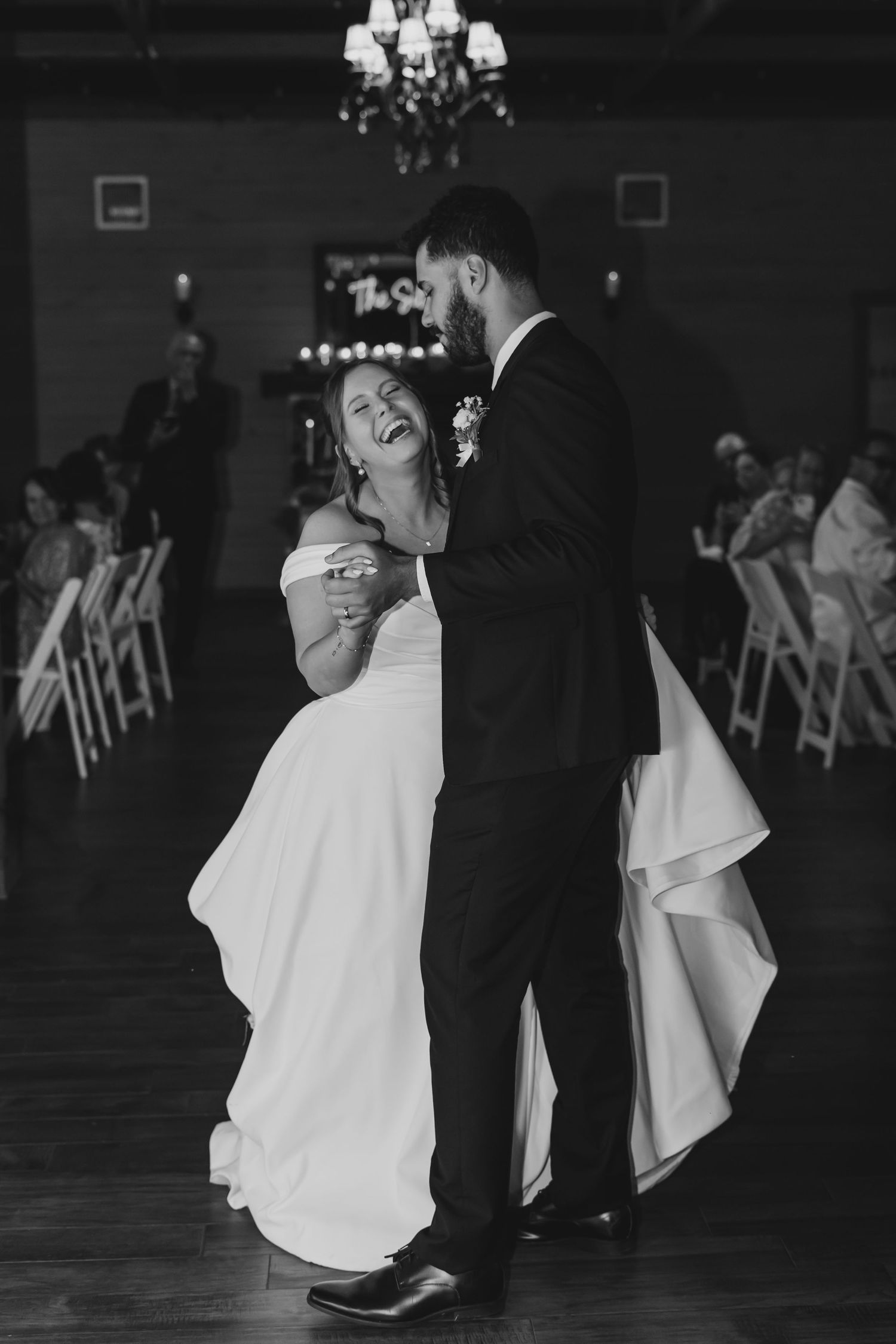 Black and white photos of a couple's first dance at their wedding reception.