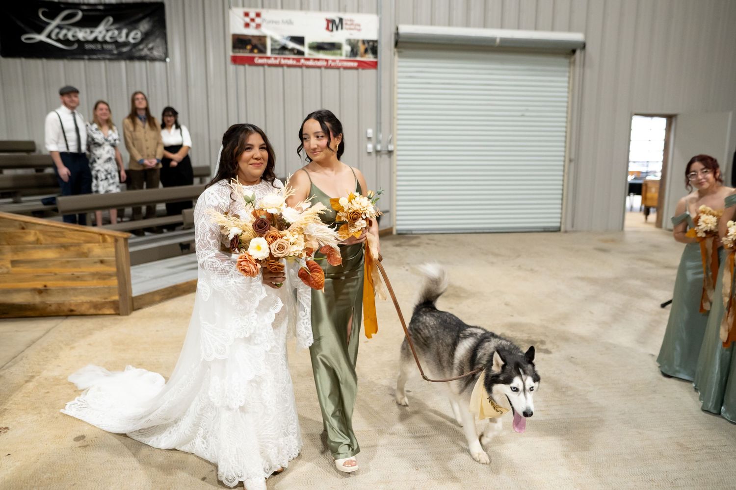 A wedding celebration in an industrial venue with a husky dog joining the bridal party.