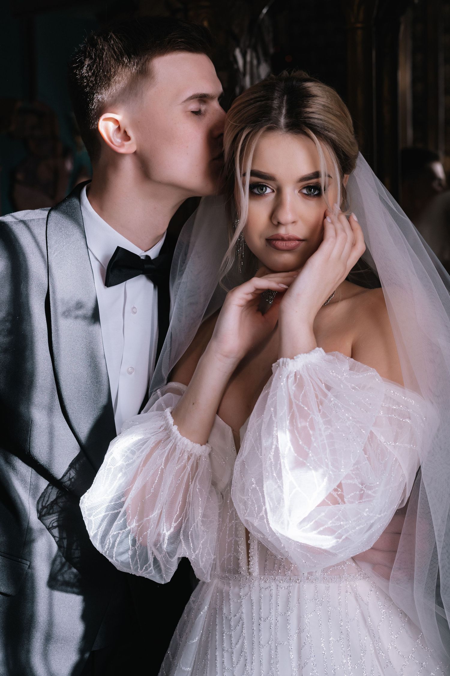 A romantic wedding photoshoot sequence showing intimate moments between a couple in formal attire and bridal veil.