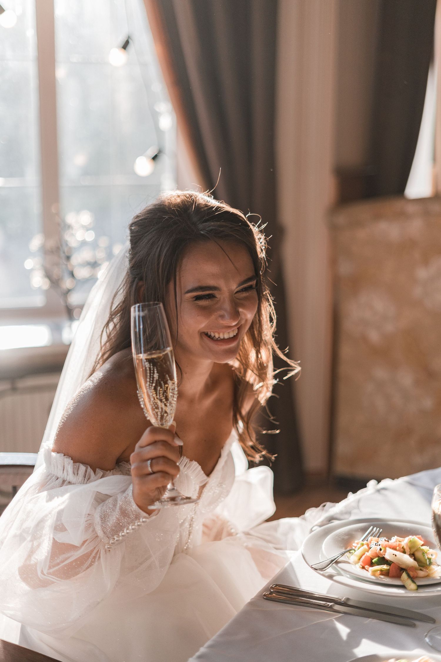 A sequence of candid moments showing a bride laughing joyfully at a restaurant table in warm natural lighting.