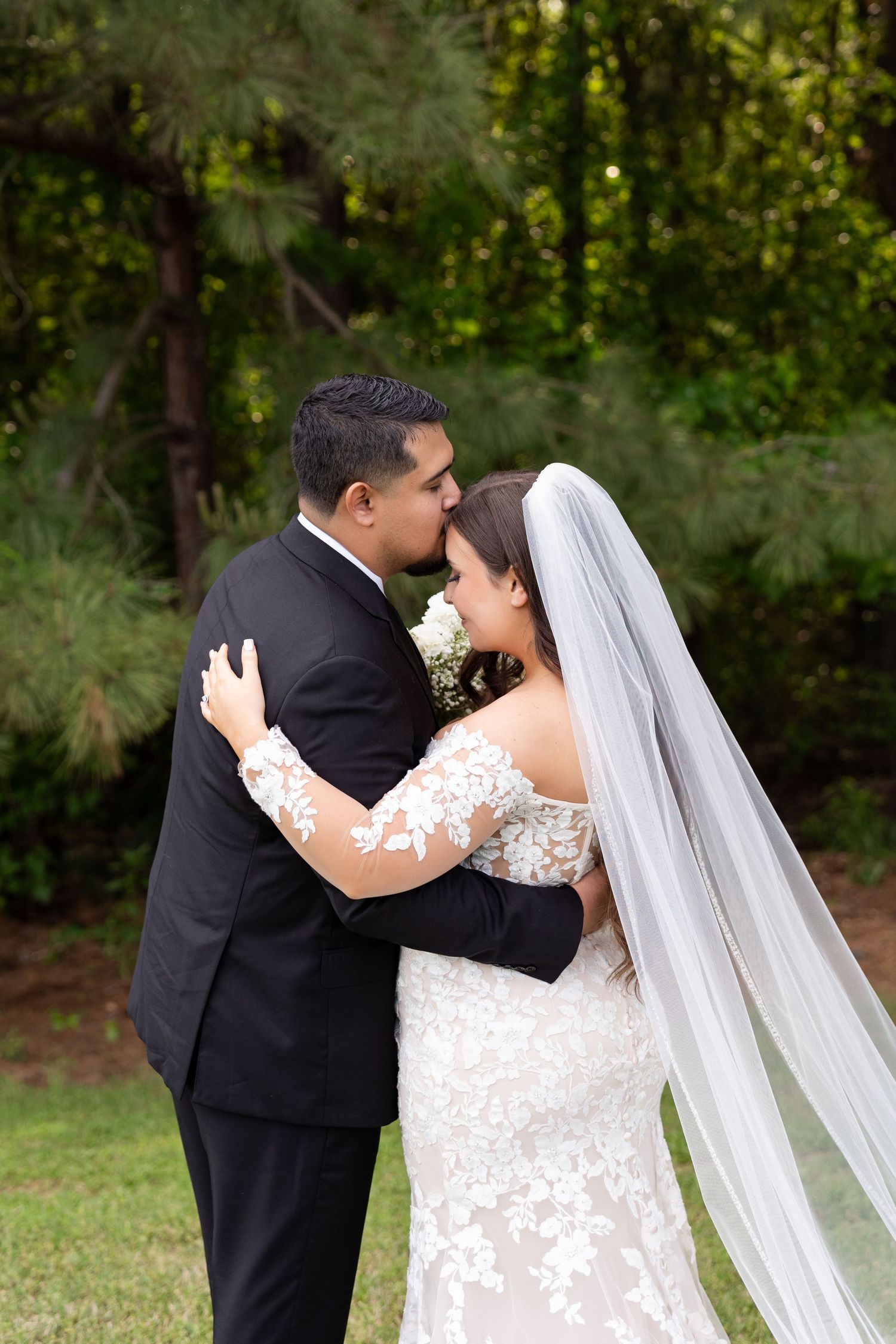 A romantic sequence of wedding photos showing a couple in formal attire embracing outdoors in a garden setting.
