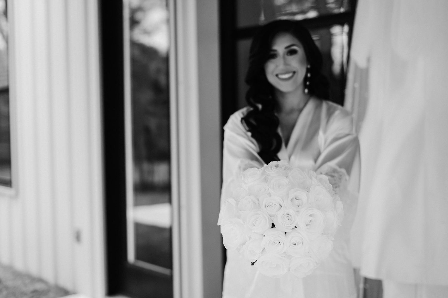A black and white photo collage shows a bride in a white dress posing in different romantic settings.