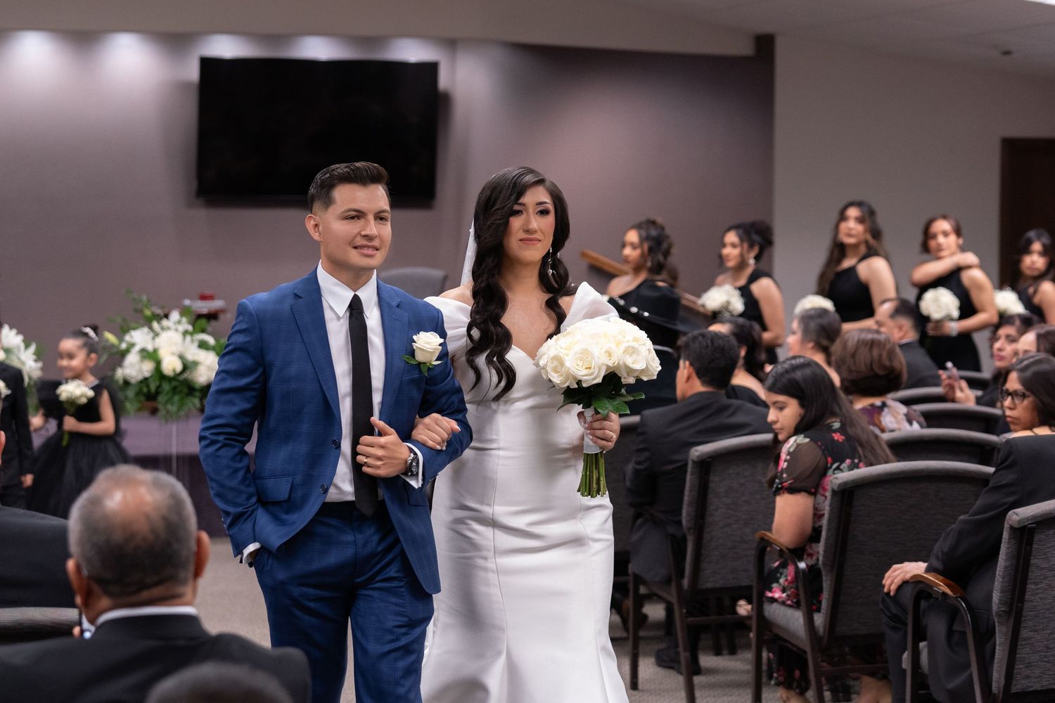 A wedding ceremony montage showing guests seated in a hall while a couple walks down the aisle in formal attire.