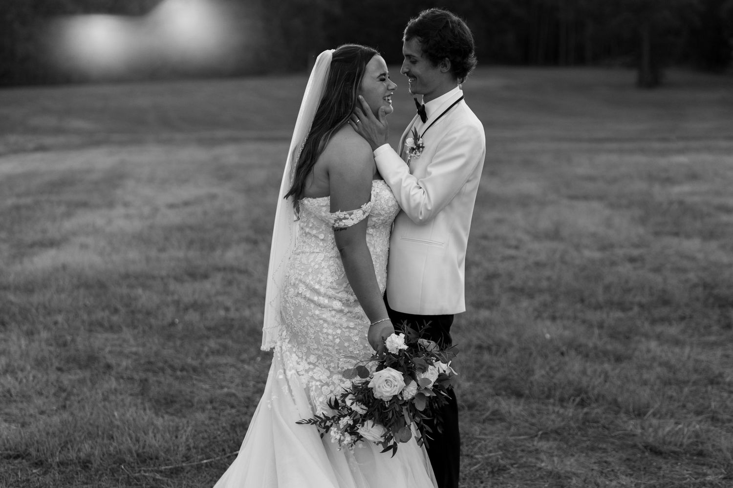 Black and white wedding photo series showing intimate moments between a couple during their outdoor celebration.