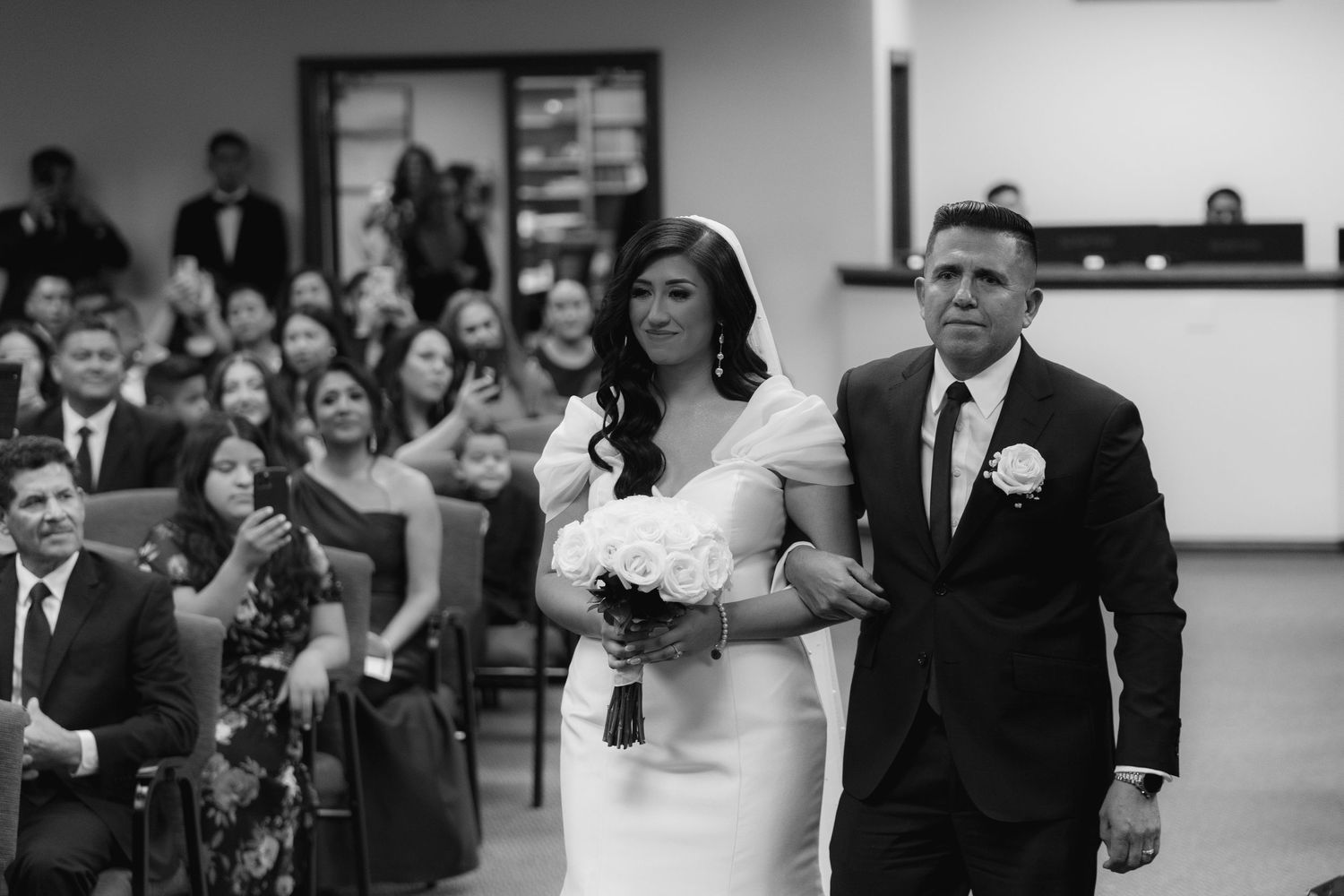 A black and white photo collage of wedding moments showing emotional reactions during a ceremony and reception.