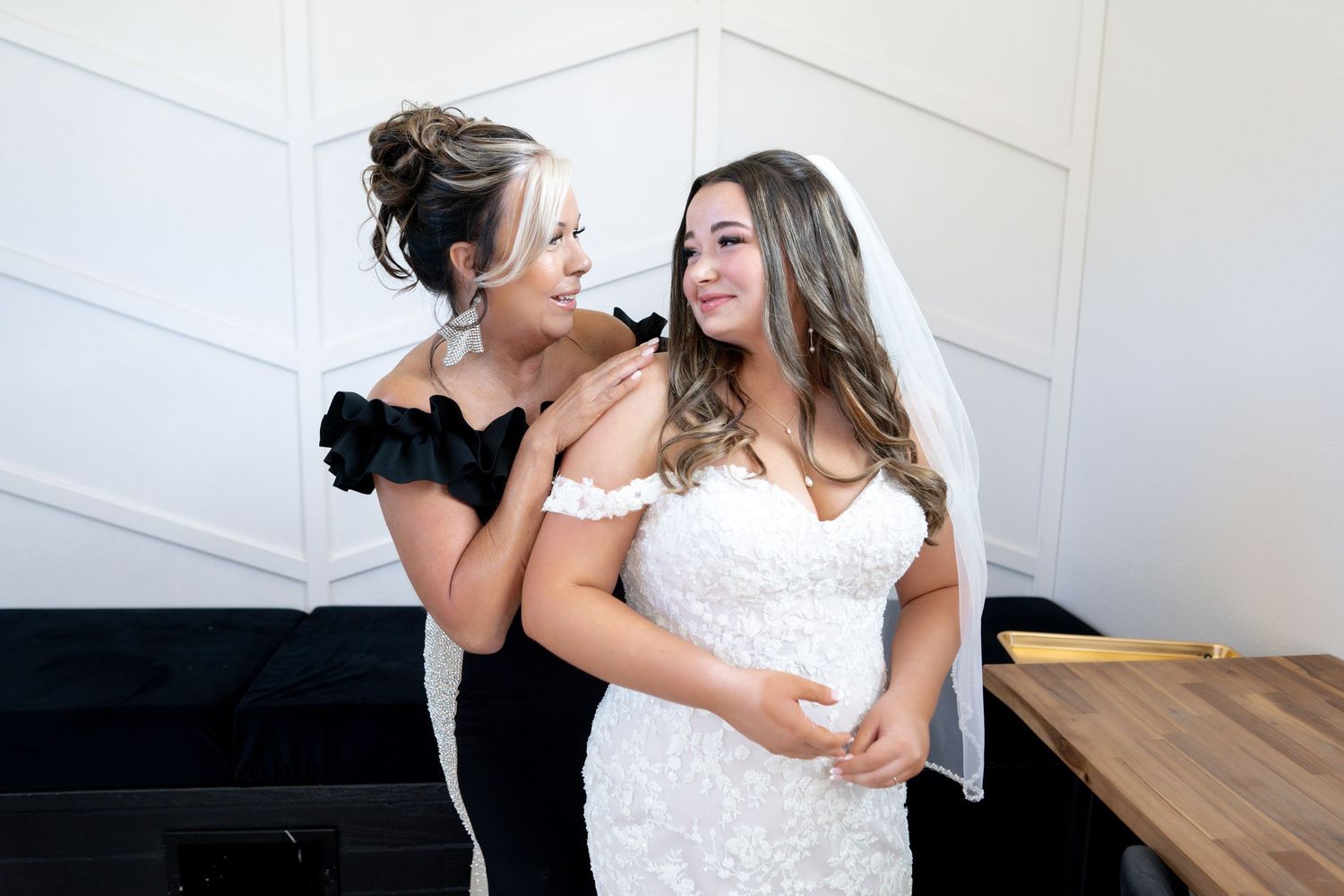 A romantic couple in wedding attire shares tender moments during their photo session.